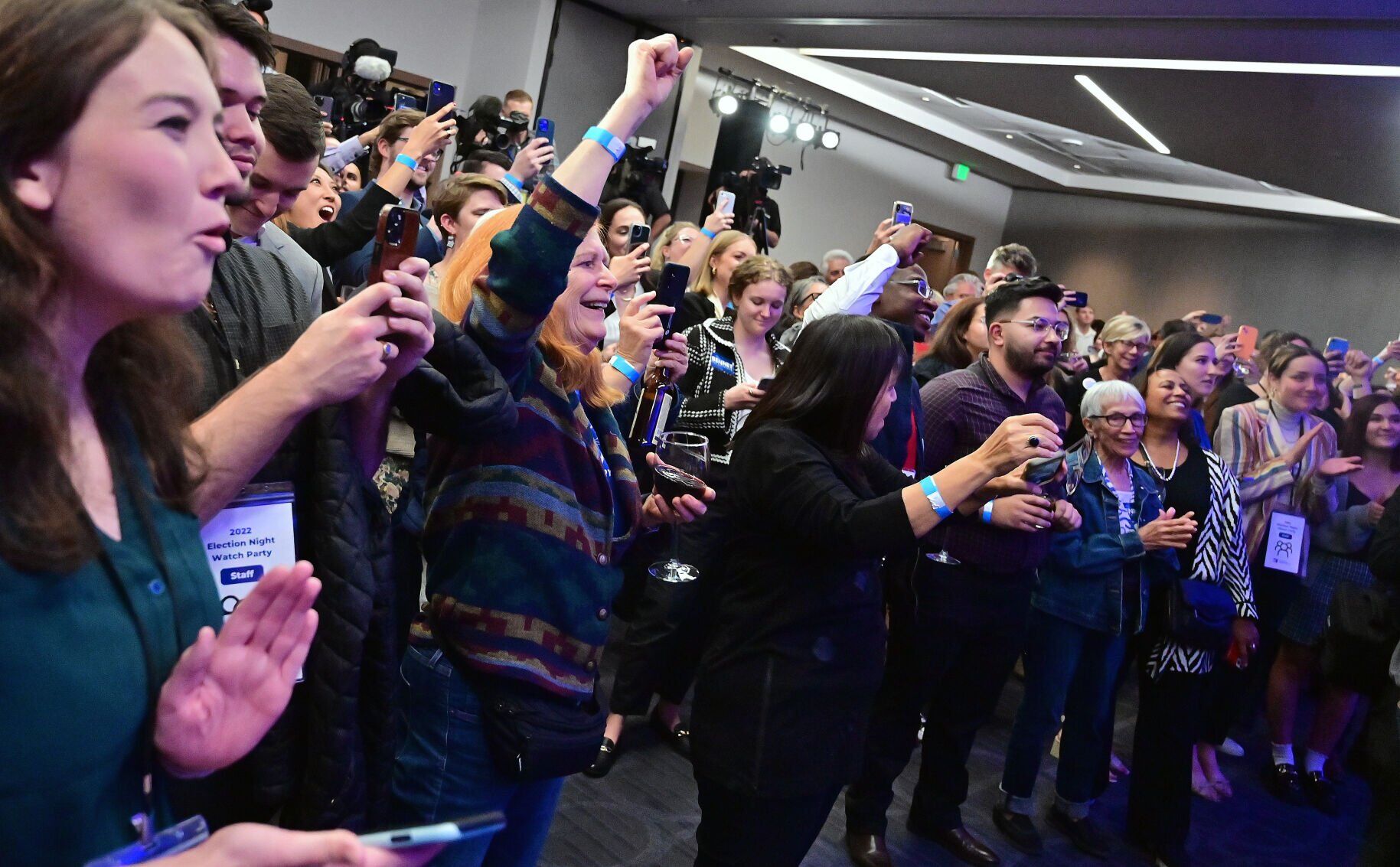 Cheers erupt at the Democratic watch party as U.S. Sen. Michael Bennet gives his victory speech on election night at the Art Hotel on Tues., Nov. 8, 2022. (Photo by Jerilee Bennett, The Gazette)