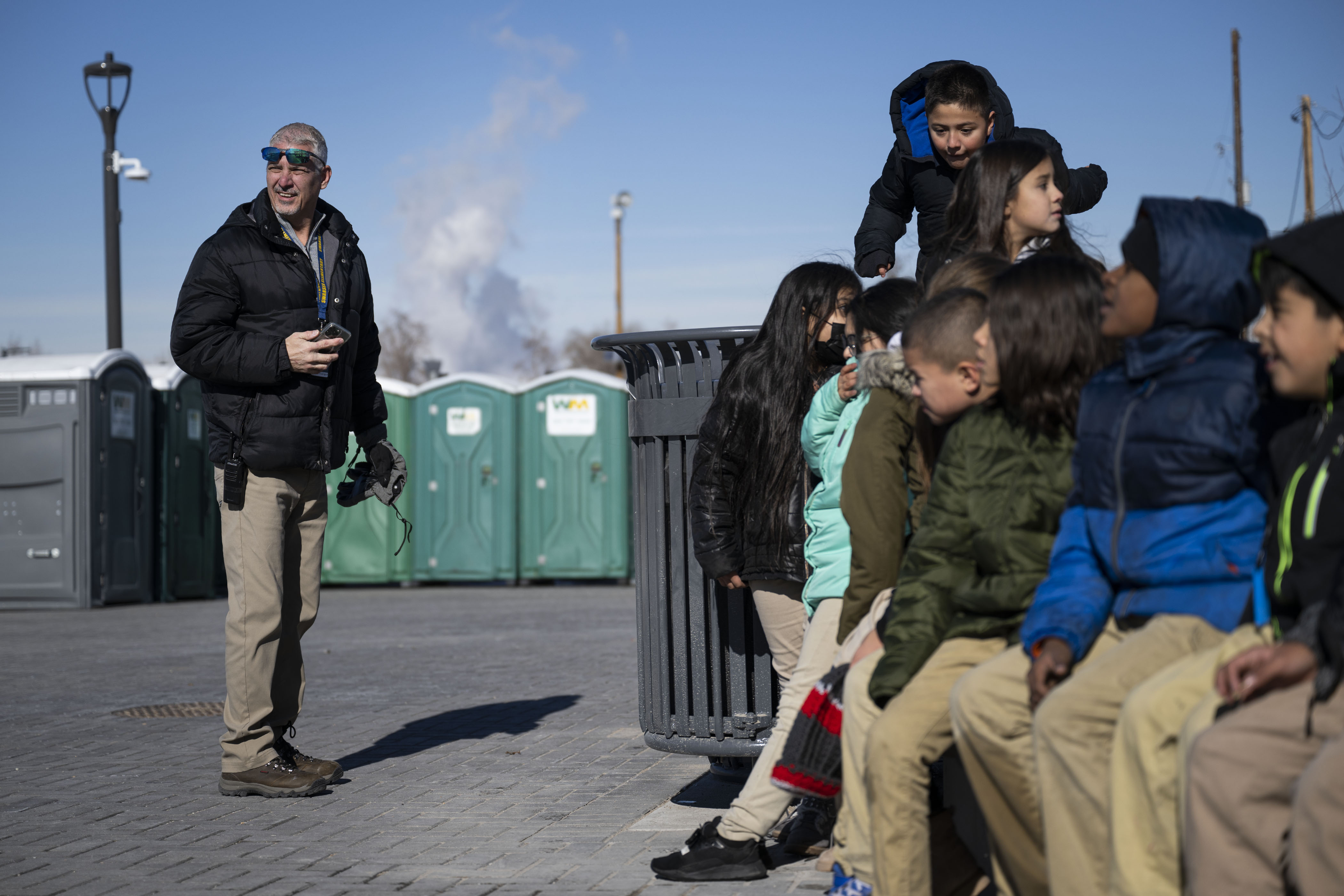 Swansea Elementary School vice principal Marc Rodriguez keeps an eye on students checking out some of he new playground equipment after a ribbon-cutting event to celebrate the opening of the 4-acre Cover Park over Interstate 70 between Brighton Boulevard and Colorado Boulevard on Wednesday, Nov. 30, 2022, in Denver, Colo. (Timothy Hurst/The Gazette) (TimHursttim.hurst@gazette.comhttps://secure.gravatar.com/avatar/aca82bd62b4ee425c598527cd6faa1b1?d=mm&r=g)