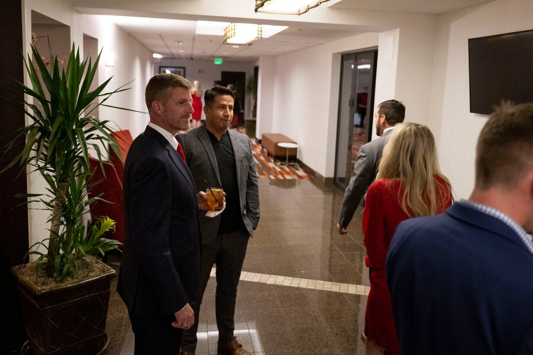 Colorado Republican 7th District congressional candidate Erik Aaland, left, waits in the hallway before heading into the VIP area during the Colorado GOP Election Night Party on Tuesday, Nov. 8, 2022, at the DoubleTree by Hilton DTC in Greenwood Village, Colo. (Timothy Hurst/The Gazette) (TIMOTHY HURST/DENVER GAZETTE)
