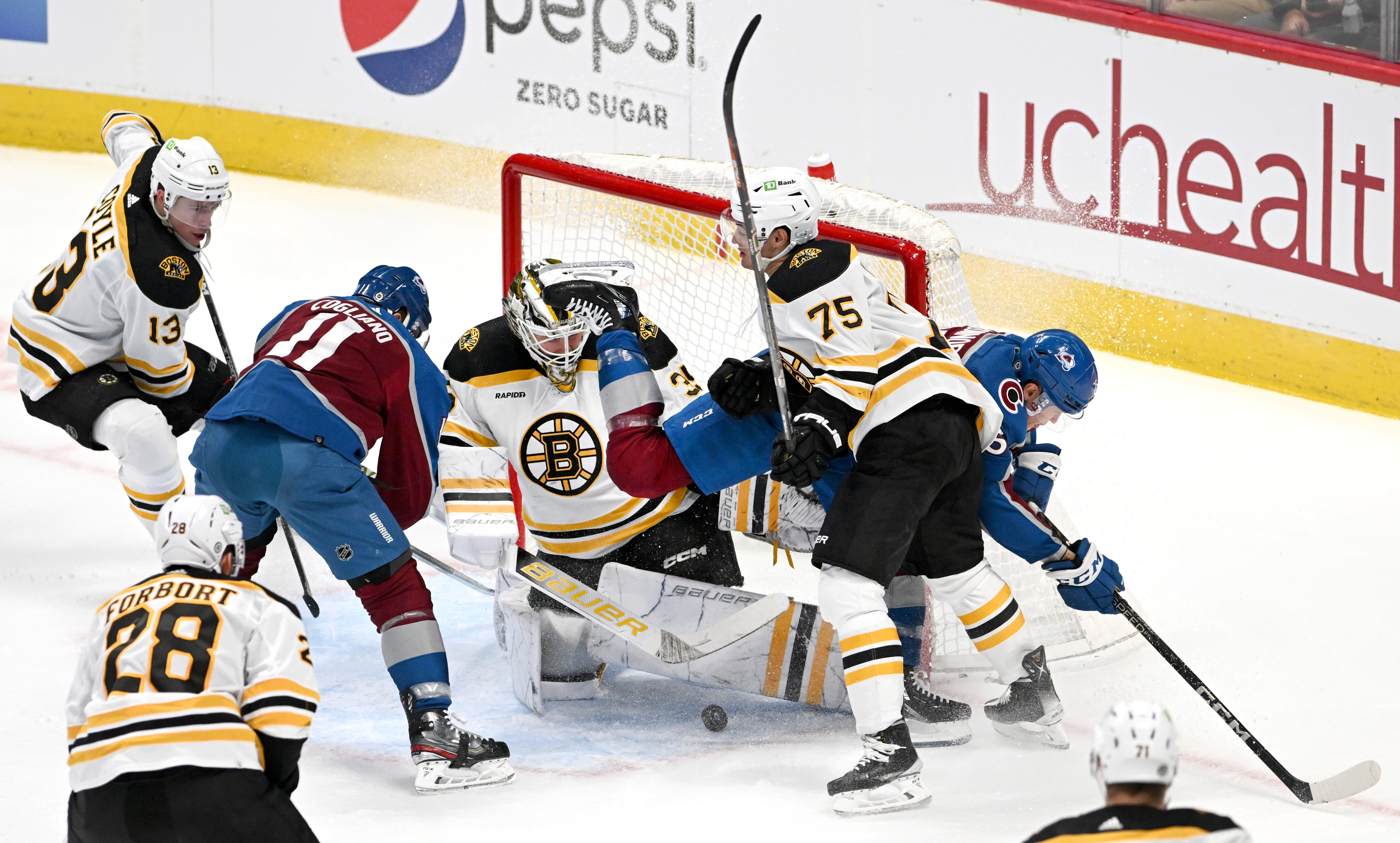 Boston Bruins goaltender Linus Ullmark (35) makes a save as Colorado Avalanche right wing Logan O'Connor (25) and center Andrew Cogliano (11) struggle for a rebound during the second period Wednesday, Dec. 7, 2022, at Ball Arena in Denver. (The Gazette, Christian Murdock) (Christian Murdock/The Gazette)
