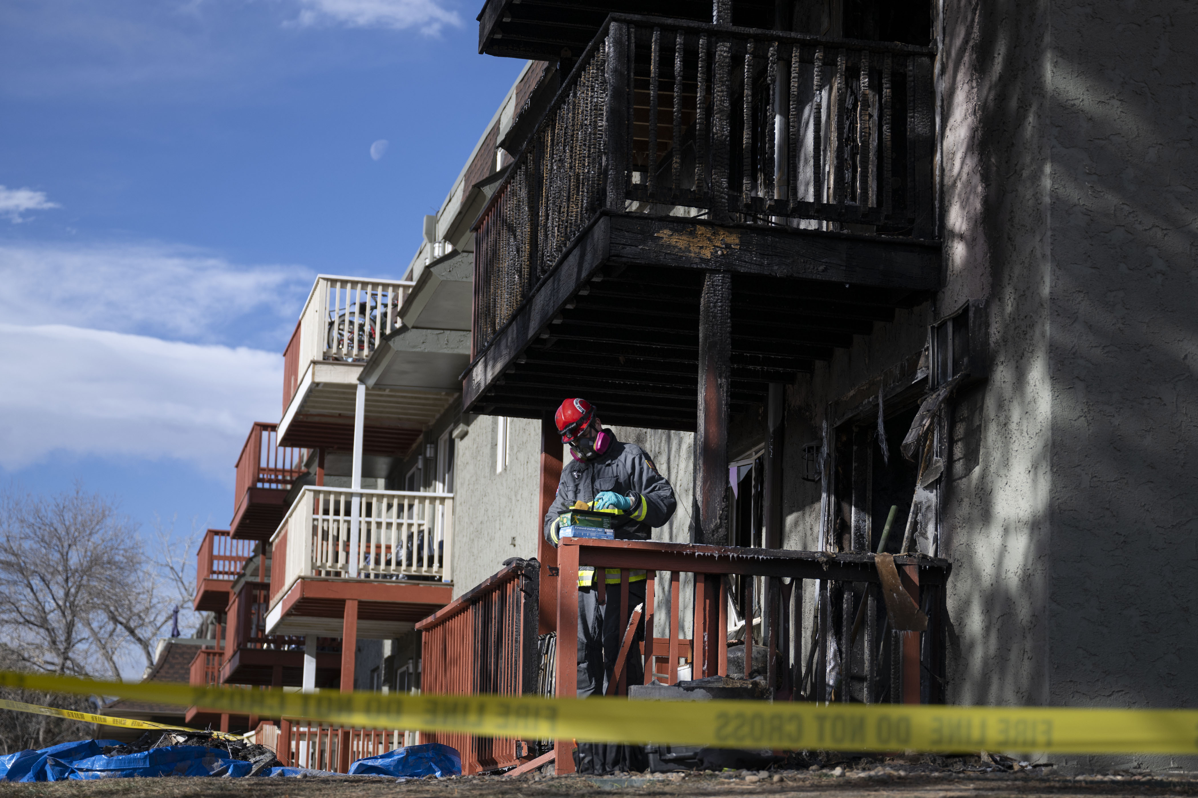 Arvada Fire Department investigators work the scene of an overnight apartment fire at the Village West apartments on West 58th Avenue on Wednesday, Dec. 14, 2022, in Arvada, Colo. One person and multiple pets died in the fire that consumed three apartments and caused heavy smoke damage to a total of 29 units. An estimated 50 plus people were evacuated. (Timothy Hurst/The Denver Gazette) (TimHursttim.hurst@gazette.comhttps://secure.gravatar.com/avatar/aca82bd62b4ee425c598527cd6faa1b1?d=mm&r=g)