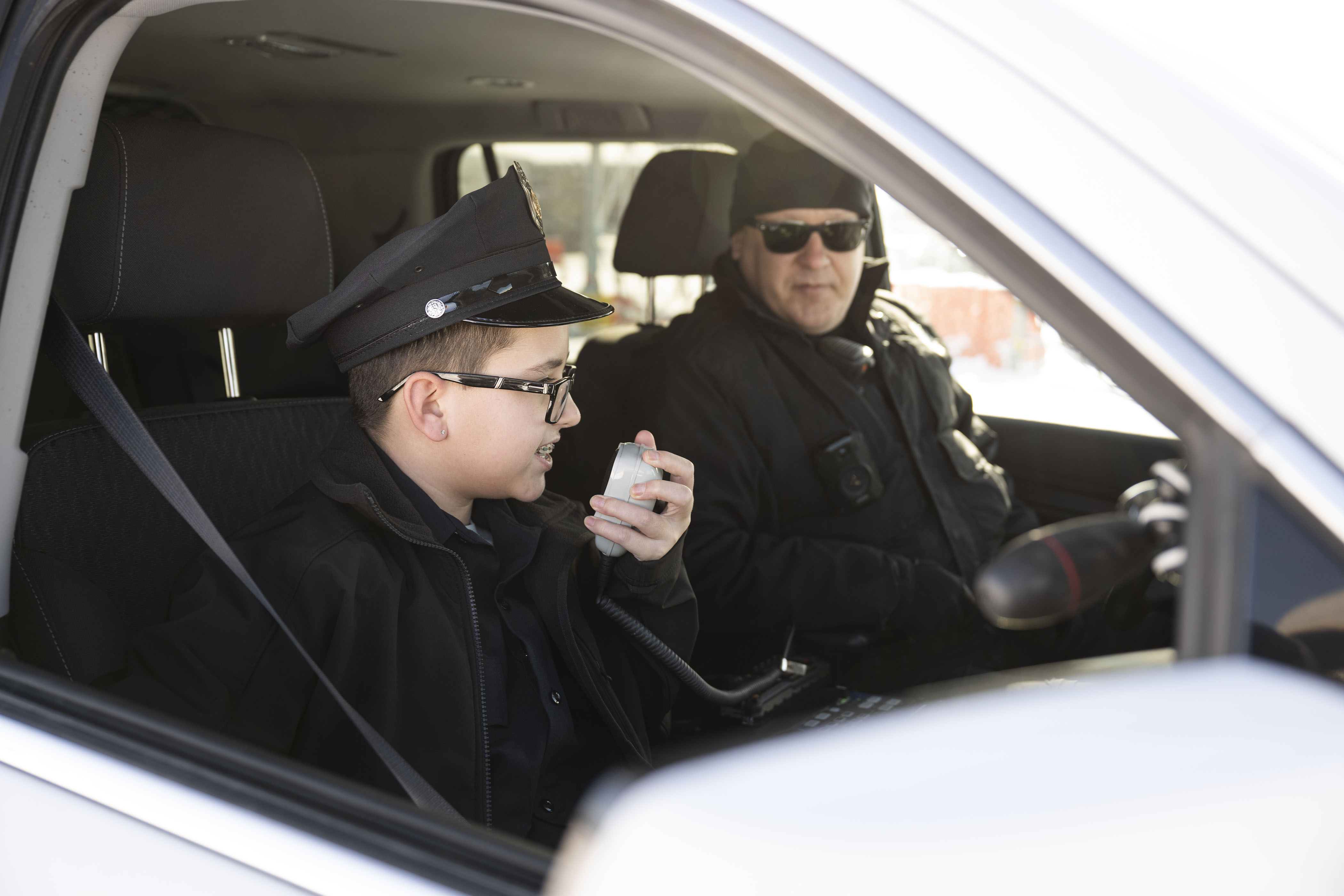 Kamorin, 14, no last name given, calls over the radio after giving a driver a 