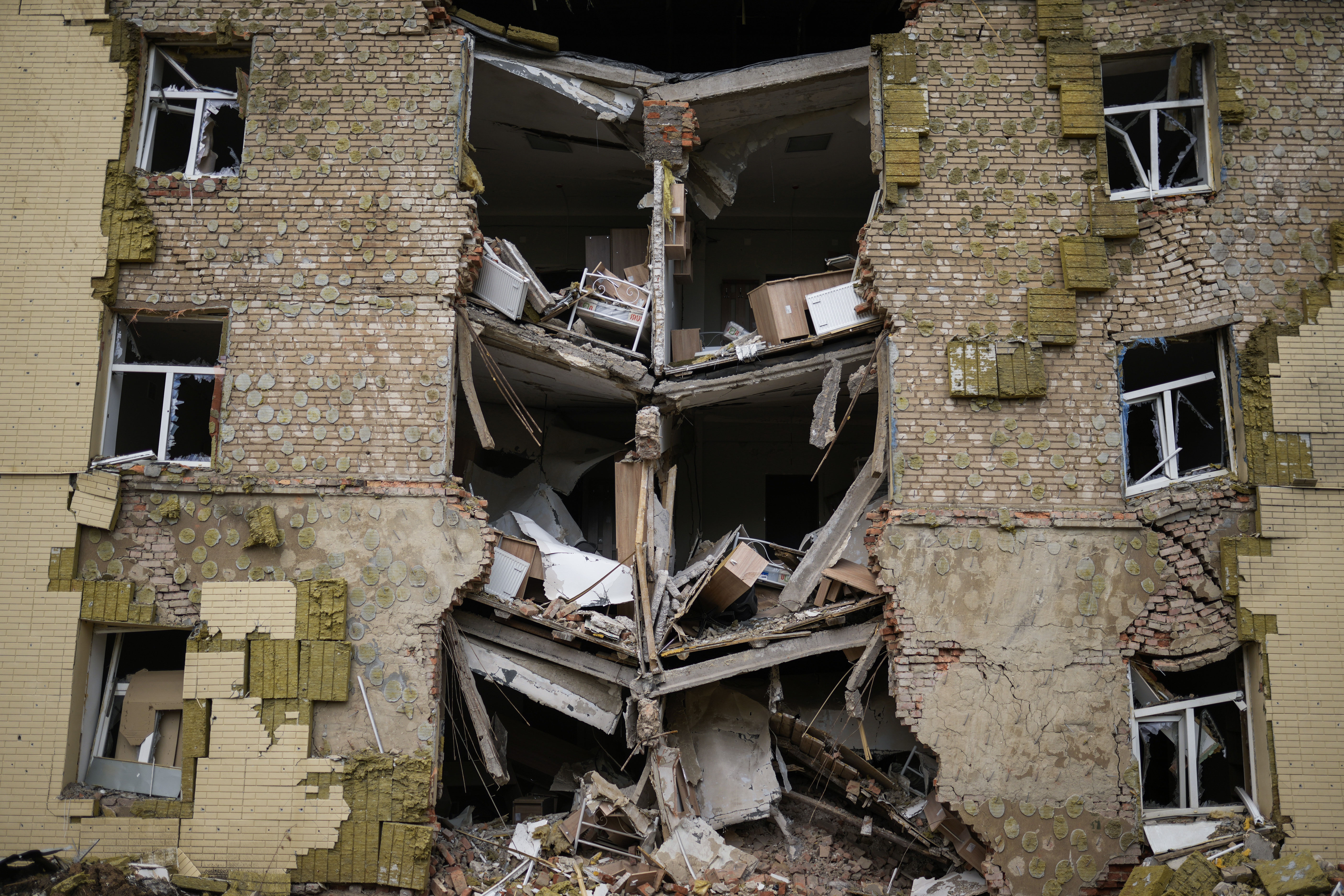 Debris hangs from a residential building heavily damaged in a Russian bombing in Bakhmut, eastern Ukraine, eastern Ukraine, Saturday, May 28, 2022. Fighting has raged around Lysychansk and neighbouring Sievierodonetsk, the last major cities under Ukrainian control in Luhansk region. (AP Photo/Francisco Seco) (FRANCISCO SECO/ASSOCIATED PRESS)