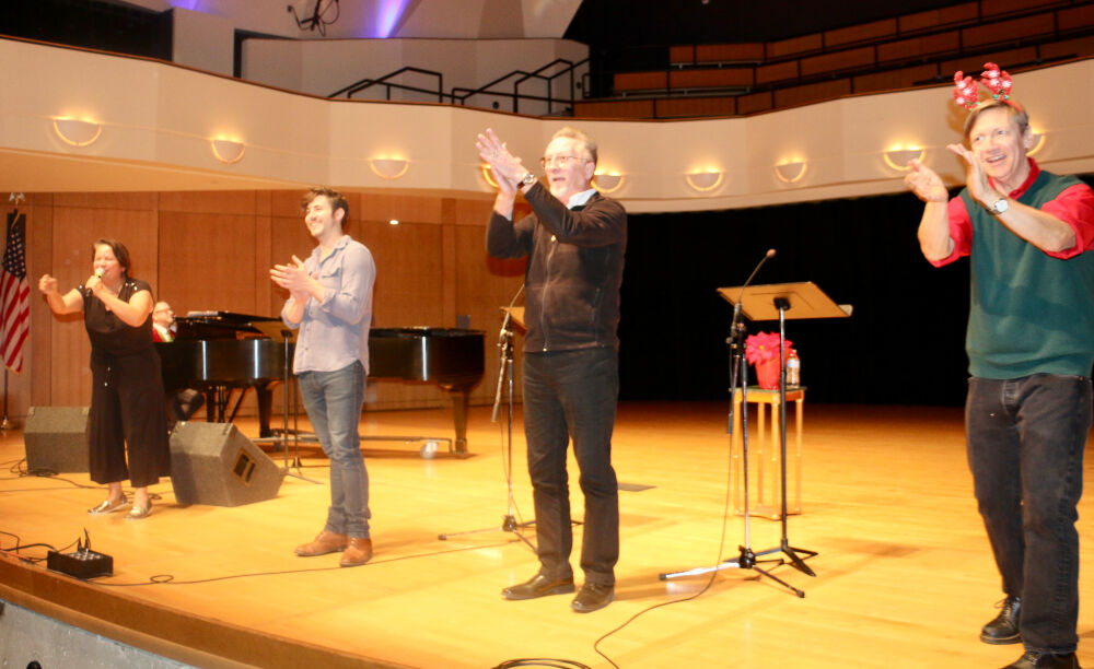 Curtain call for Stories on Stage's Dec. 18 'Making Merry' event at the King Center on the Auraria campus, from left: GerRee Hinshaw, John Hauser, Jamie Horton and Anthony Powell. (JOHN MOORE/DENVER GAZETTE)