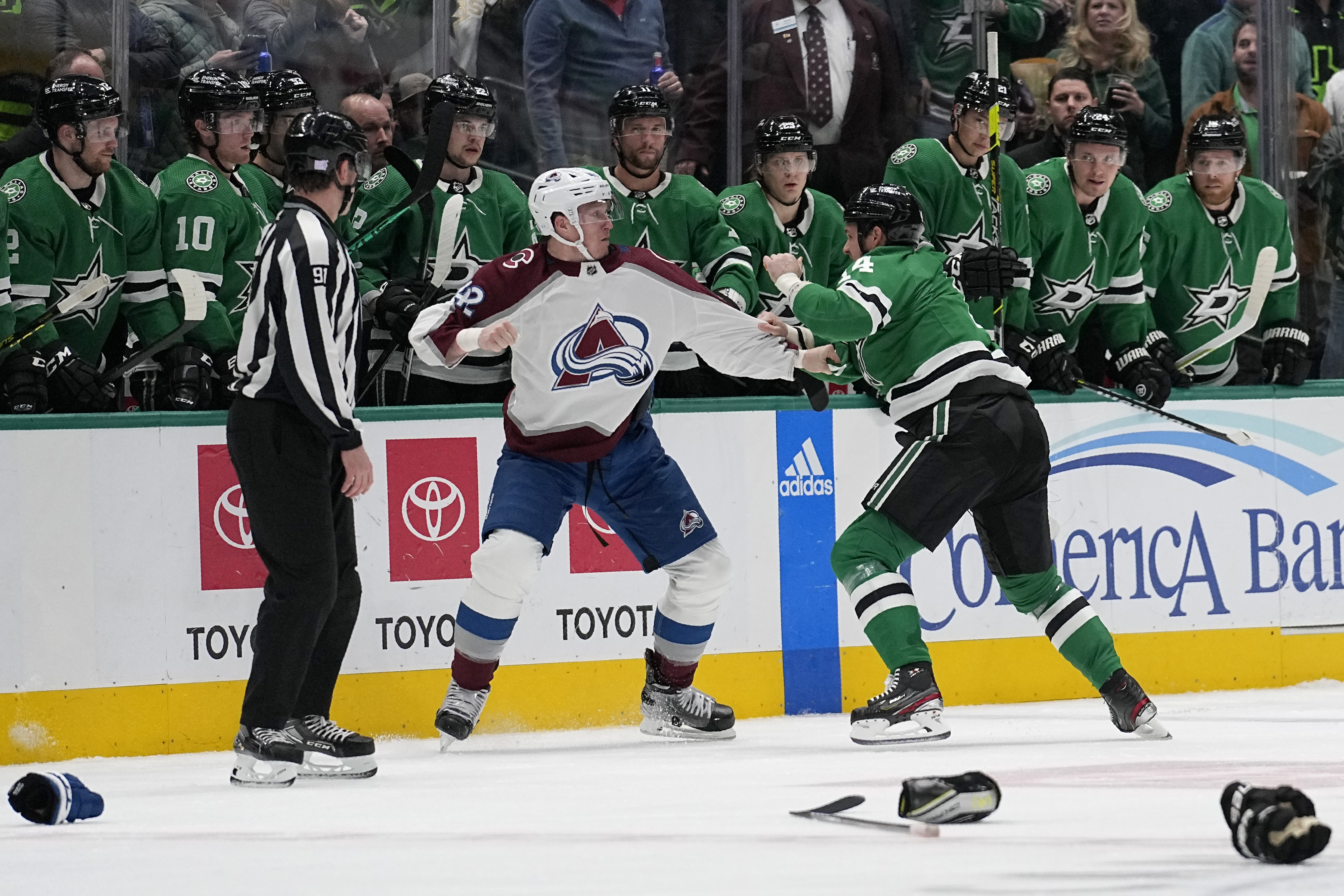 Colorado Avalanche defenseman Josh Manson, left, and Dallas Stars left wing Jamie Benn (14) fight in front of the Stars bench in the second period of an NHL hockey game Monday, Nov. 21, 2022, in Dallas. (AP Photo/Tony Gutierrez) (Tony Gutierrez)