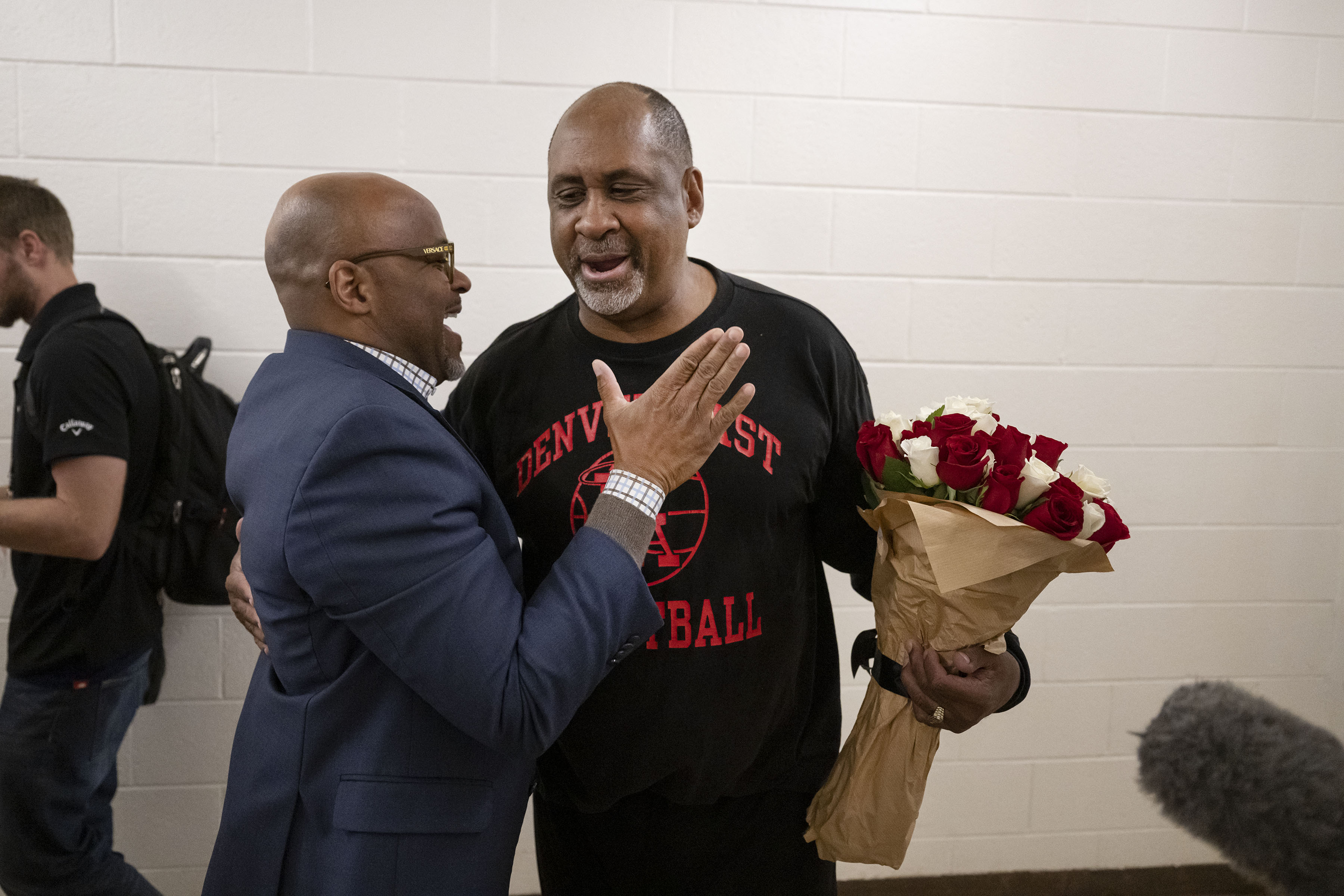 Denver East boys basketball head coach Rudy Carey is greeted by Denver mayor Michael Hancock after his record-breaking 877th win against Palmer High School on Tuesday, Dec. 13, 2022, in Denver, Colo. (Timothy Hurst/The Gazette) (TimHursttim.hurst@gazette.comhttps://secure.gravatar.com/avatar/aca82bd62b4ee425c598527cd6faa1b1?d=mm&r=g)