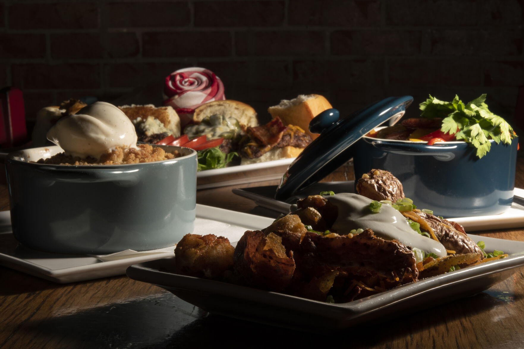 Summa Restaurant (Located at: 817 West Colorado Ave.) “Loaded Potatoes, Cobbler, Sausage and Peppers D’Oven with Burger Picnic” Tuesday December 6, 2022. Photo by Jeff Kearney. (Jeff Kearney)