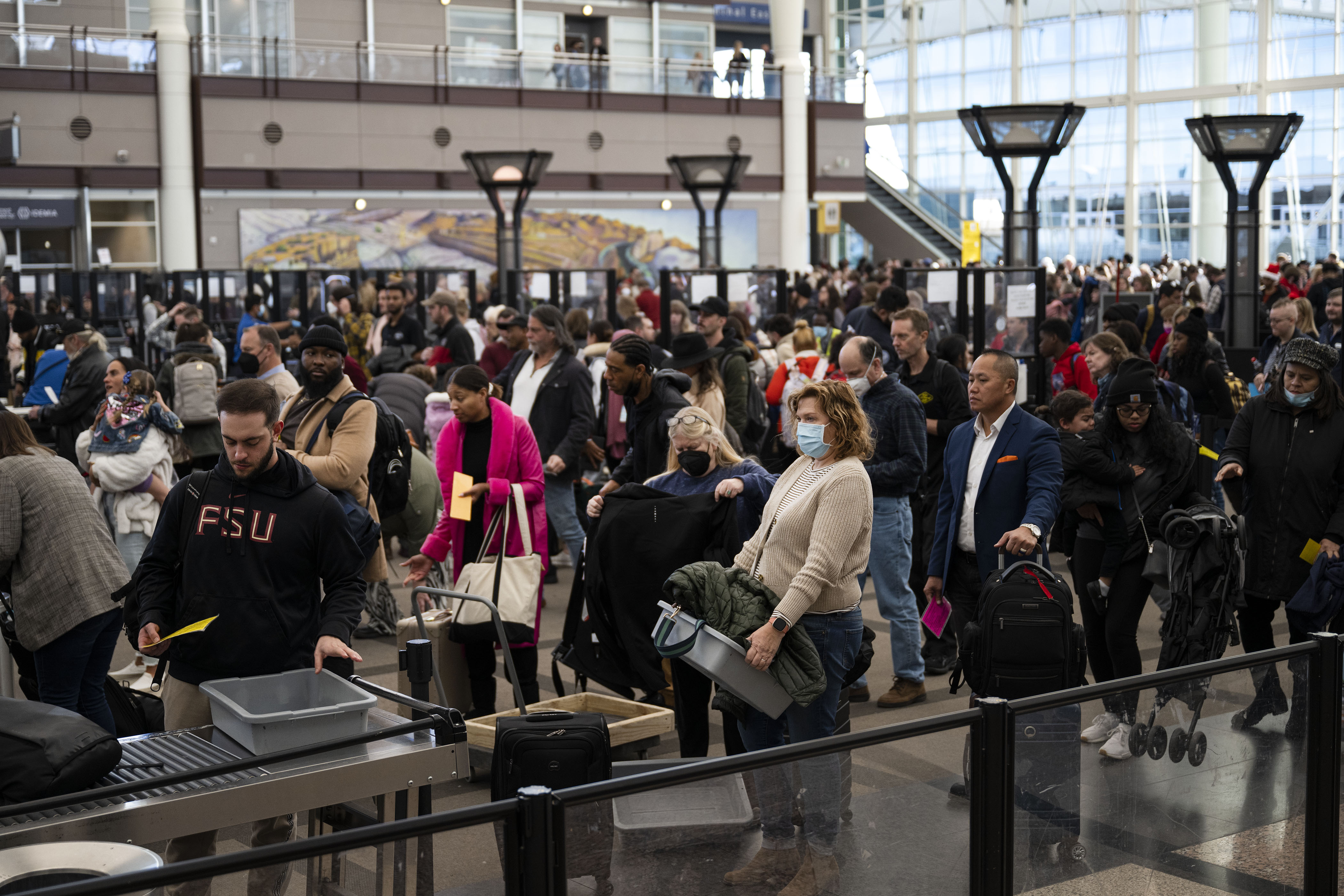Travelers wait in line to go through the South Security Checkpoint on Monday at Denver International Airport. (TimHursttim.hurst@gazette.comhttps://secure.gravatar.com/avatar/aca82bd62b4ee425c598527cd6faa1b1?d=mm&r=g)