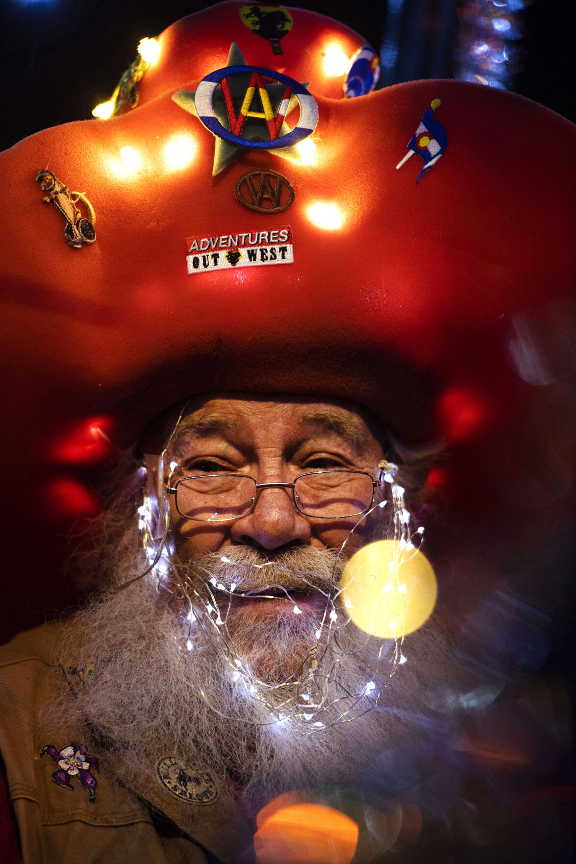 Denim Peterson drives the trolley from Adventures out West with the Garden of the Gods float during the 38th annual Festival of Lights parade in downtown Colorado Springs on Dec. 4, 2021. (The Gazette)
