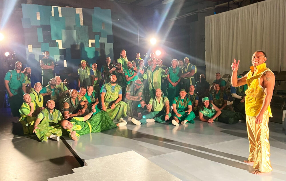 Daniel Wright, right, flashes a peace sign with some of his castmates in the Fremont Correctional Facility's production of 'Godspell,' through the DU Prison Arts Initiative. Wright played Jesus. (Courtesy Ashley Hamilton/DU Prison Arts Initiative)
