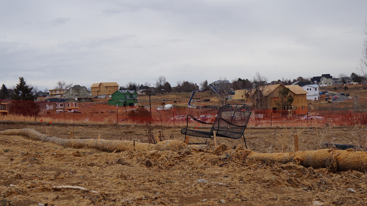 A bench in the Centennial Heights West Neighborhood in Louisville stands in an empty plot. Centennial Heights West was 
