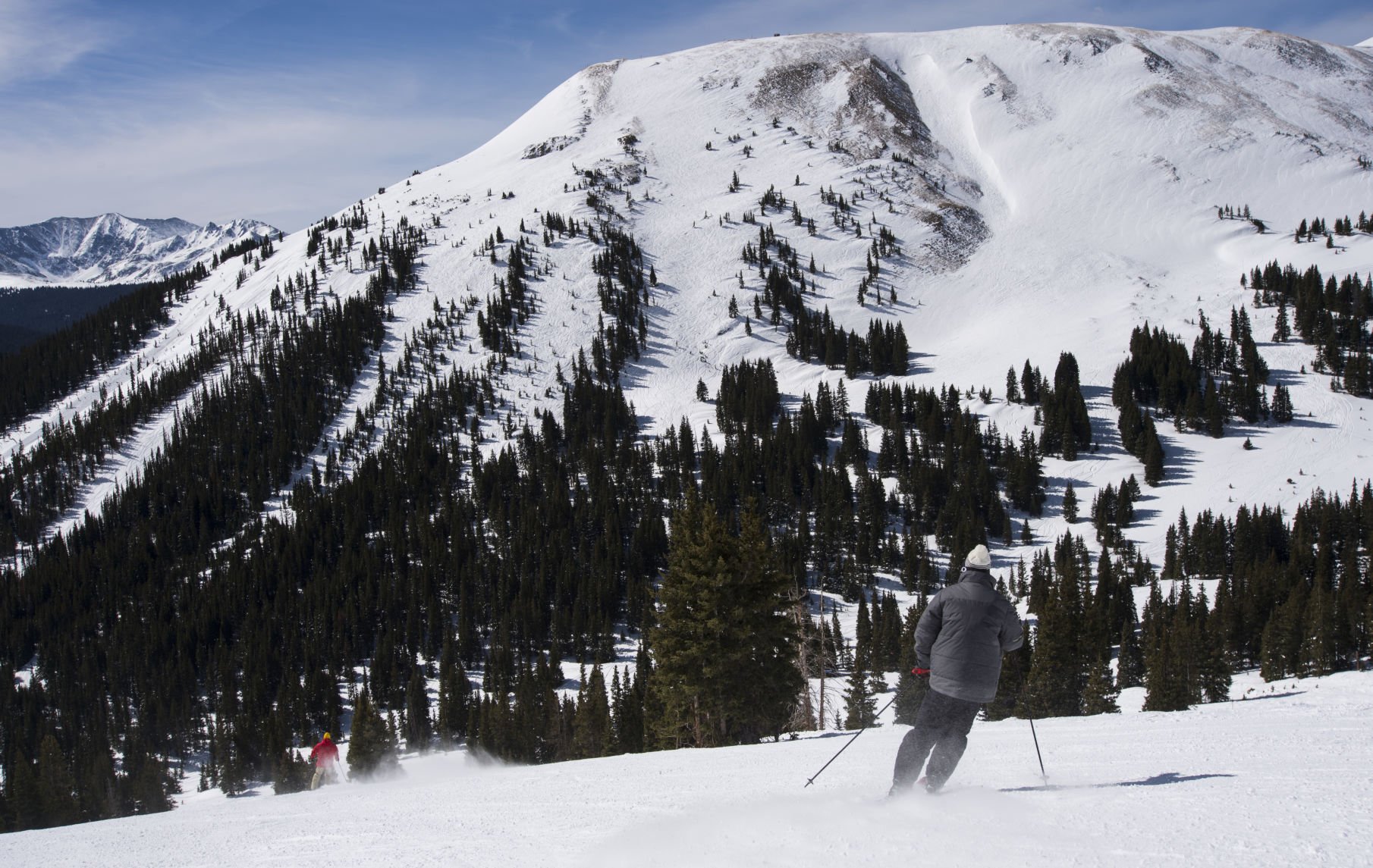 Skiers ride Copper bowl with Tucker Mountain in the background in March 2016 at Copper Mountain. (Christian Murdock, Gazette file)