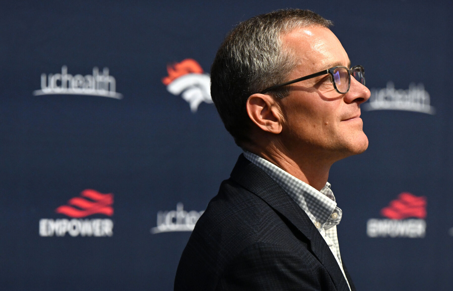 Broncos owner Greg Penner listens while other owners speak during a news conference introducing the new owners Aug. 10 at the UCHealth Training Center in Englewood. (Christian Murdock, The Gazette file)