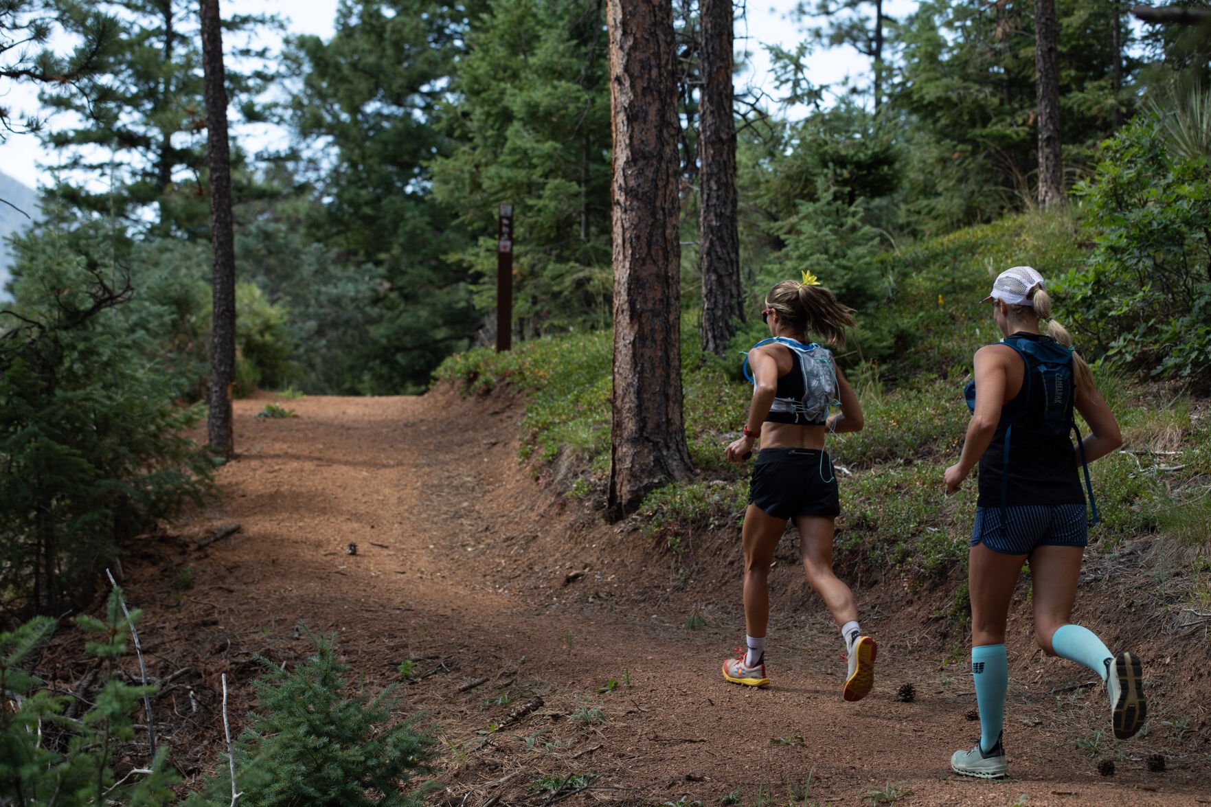 Trail runners Sara Striegel and Natascha Leonardo keep up the pace during their 18-mile run up Cheyenne Canyon on the Sweetwater Canyon network. (John Stember, The Gazette)