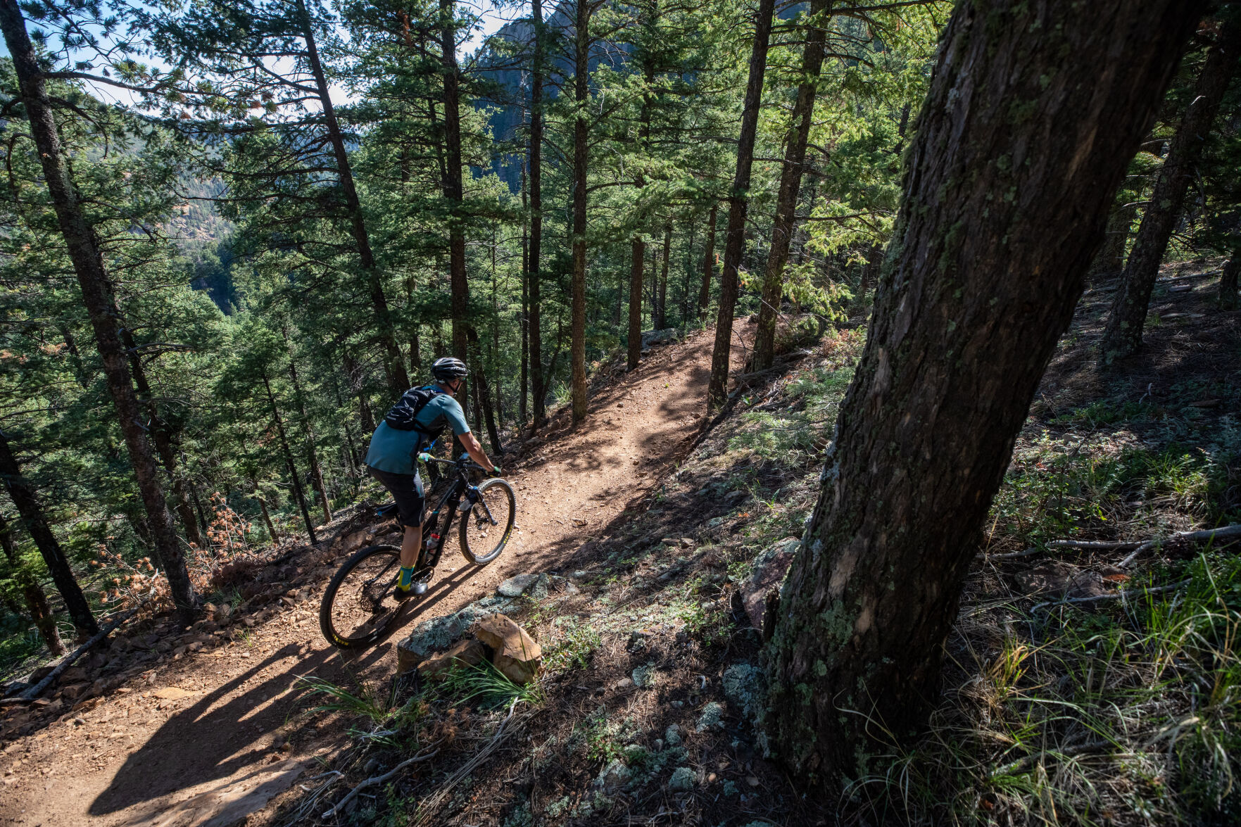 A mountain biker prepares to descend the boulder gardens and technical switchbacks of Daniels Pass trail. Most bikers access the relatively new trail system through Gold Camp Road. (JohnStemberPhoto Internjohn.stember@gazette.comhttps://secure.gravatar.com/avatar/9413e1cb22a16d941b2a54a99000f76c?d=mm&r=g)