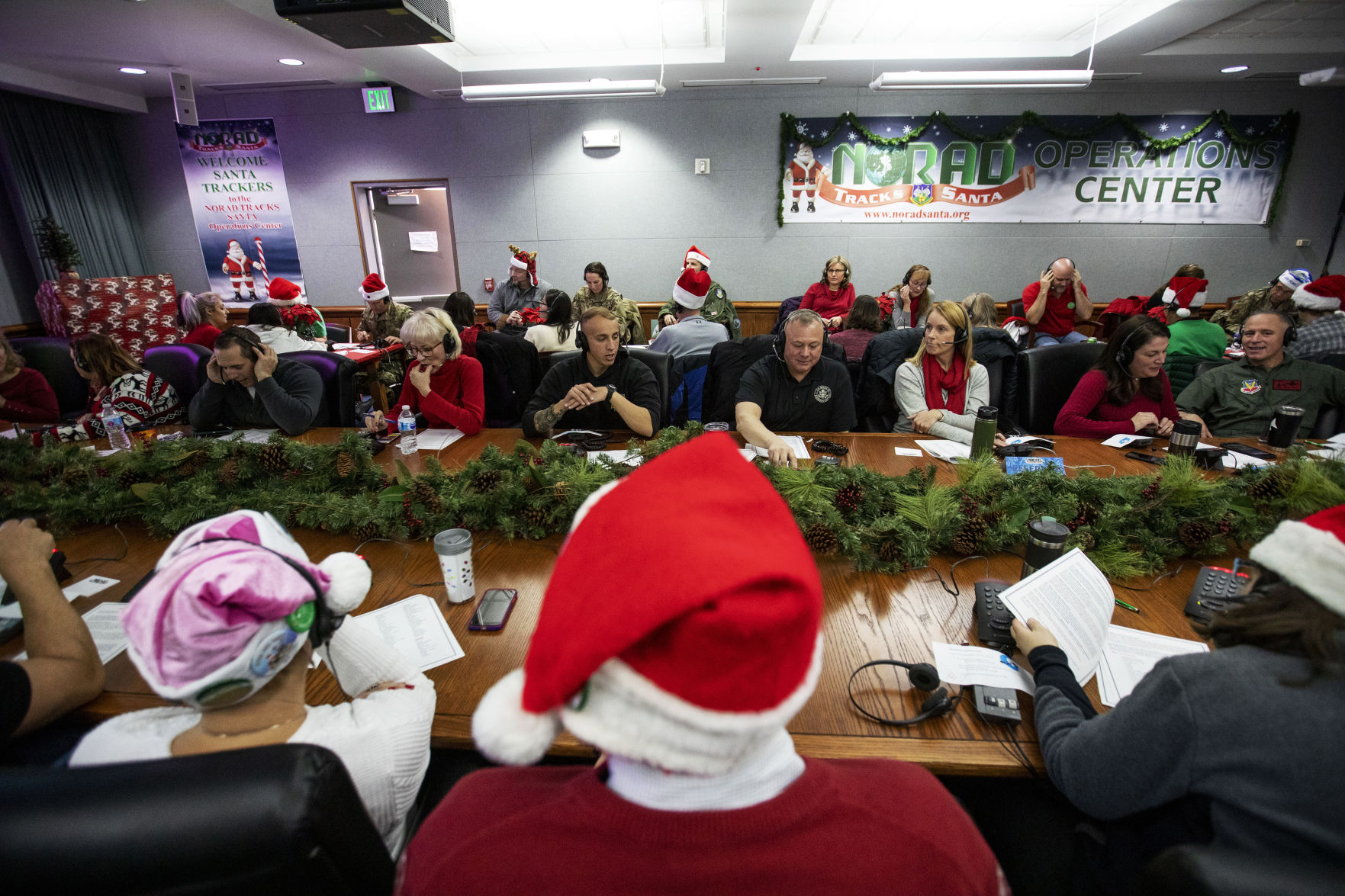 More than 1,482 volunteers answered calls from children all over the world to help them track Santa Claus at the NORAD Santa tracking call center at Peterson Air Force Base in Colorado Springs, Colo. on Christmas Eve Tuesday, Dec. 24, 2019.(Chancey Bush/ The Gazette) (Chancey Bush)