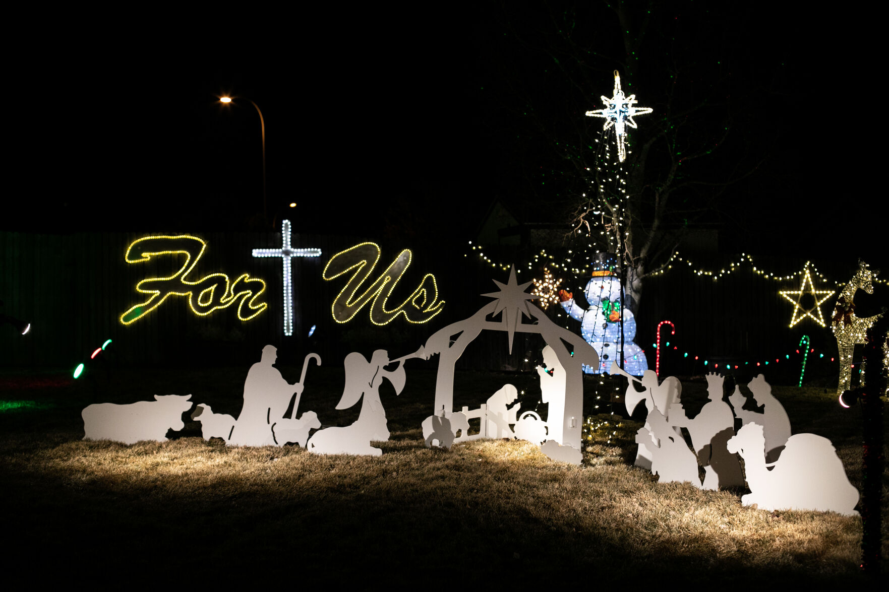 A silhouette of the Nativity scene and metal signs that read “For Us” that Mark Ingles had custom made are among his favorite decorations. (The Gazette, Parker Seibold) (Parker Seibold)