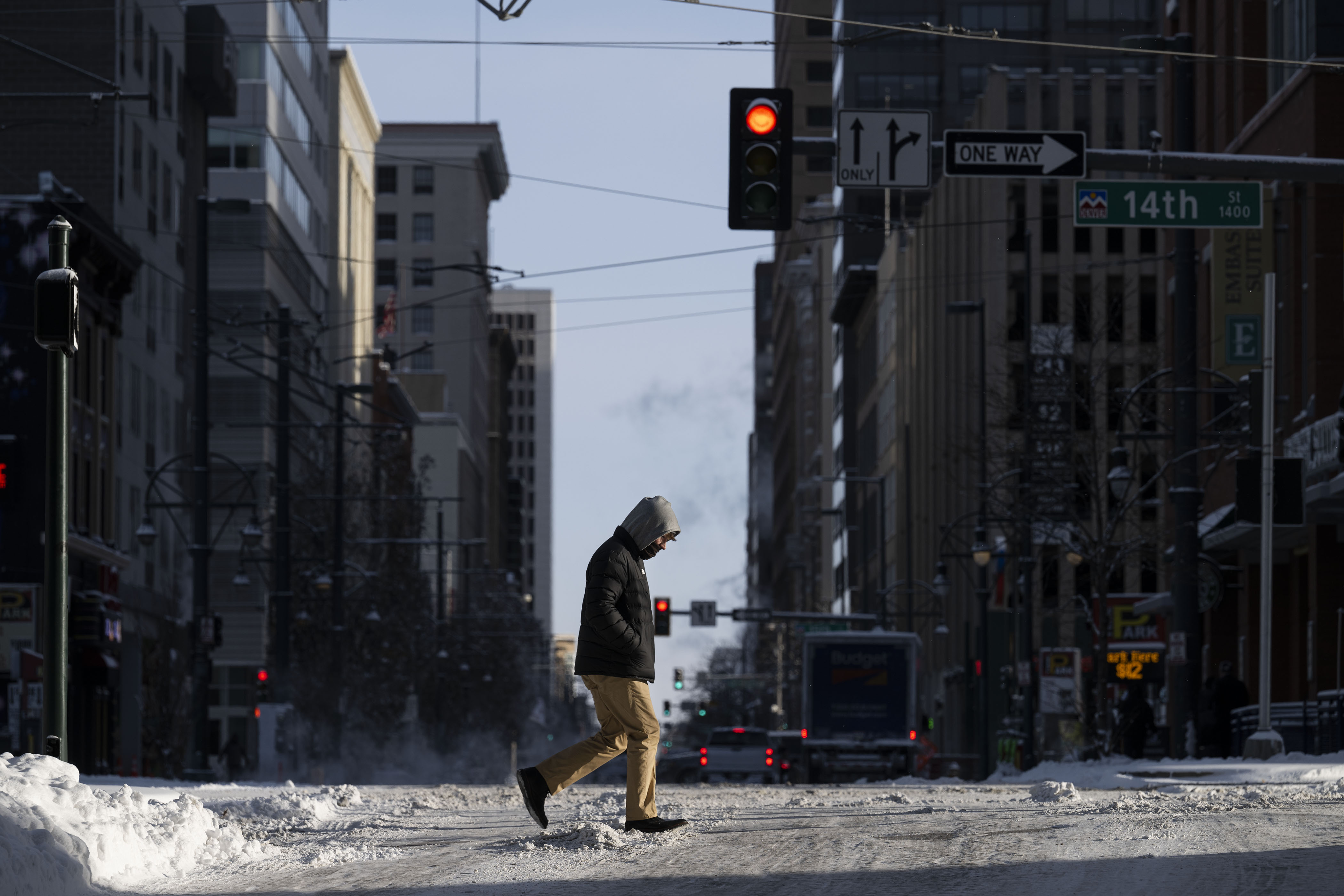Commuter Beck Schoenwetter heads to his shift at the Colorado Convention Center after an overnight snowstorm on Thursday in Denver. (TimHursttim.hurst@gazette.comhttps://secure.gravatar.com/avatar/aca82bd62b4ee425c598527cd6faa1b1?d=mm&r=g)