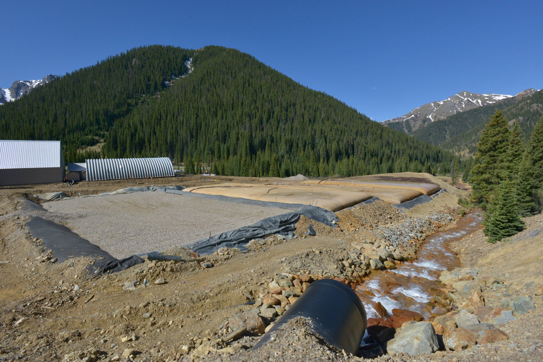 Environmental Protection Agency's Gladstone mine waste filtration plant along Cement Creek above Silverton, Colo. The plant, built in 2015 on property owned by Todd Hennis, treats ongoing acid mine waste from the Gold King mine. The plant corrects the acidity of the wastewater and filters out heavy metals by pumping it through huge permeable-membrane bags that trap the solids, before releasing the treated water back into the creek. (SCOTT WEISER/THE DENVER GAZETTE)