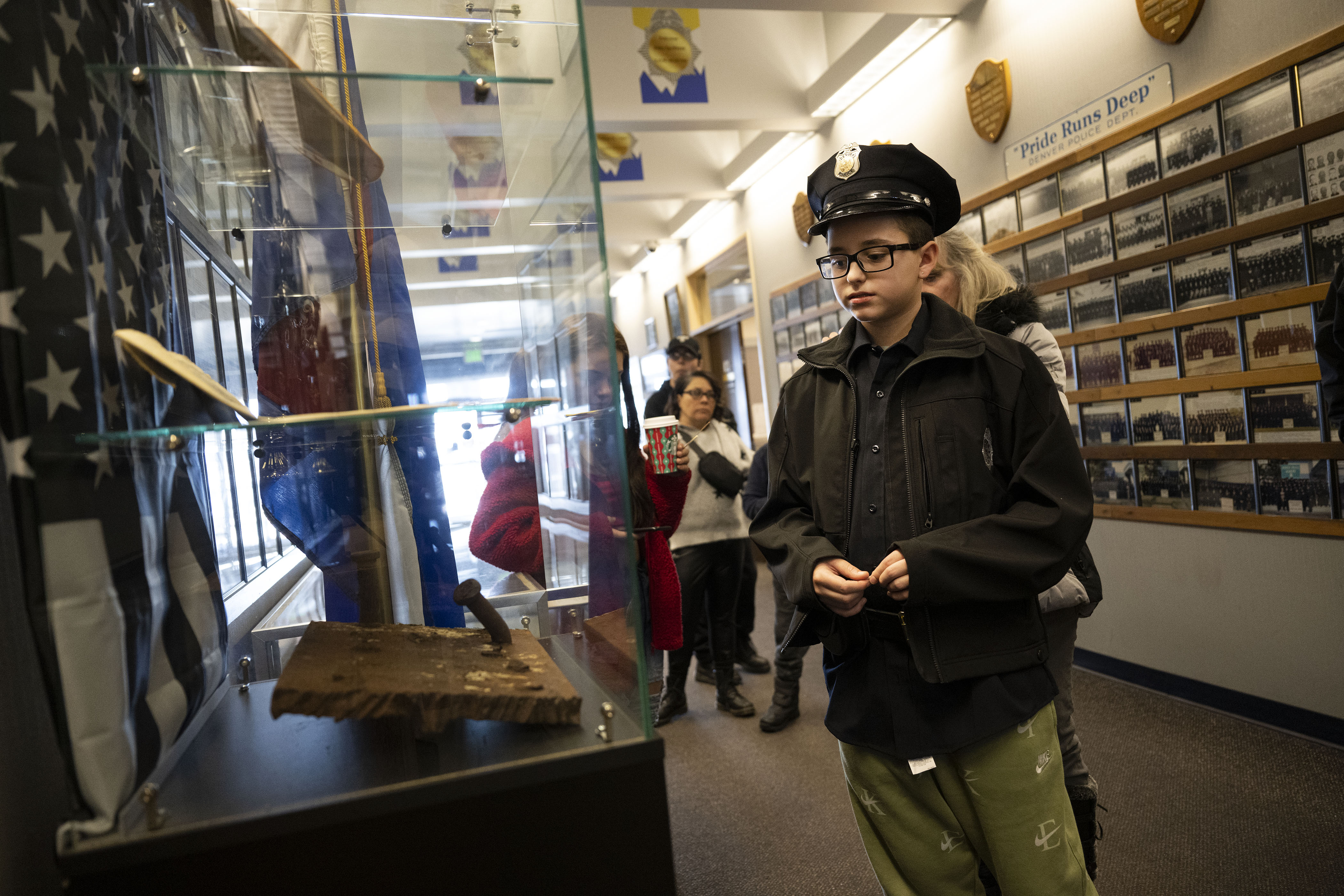 Kamorin, 14, no last name given, look at a piece of the World Trade Centers while taking a tour of the Denver Police Academy after a simulated ride along on Friday, Dec. 23, in Denver, Colo. On August 22, 2022, Kamorin was being driven home from school when a bullet fired nearby hit him in the arm. Denver police arrived and performed initial first aid. (Timothy Hurst/The Denver Gazette) (TimHursttim.hurst@gazette.comhttps://secure.gravatar.com/avatar/aca82bd62b4ee425c598527cd6faa1b1?d=mm&r=g)