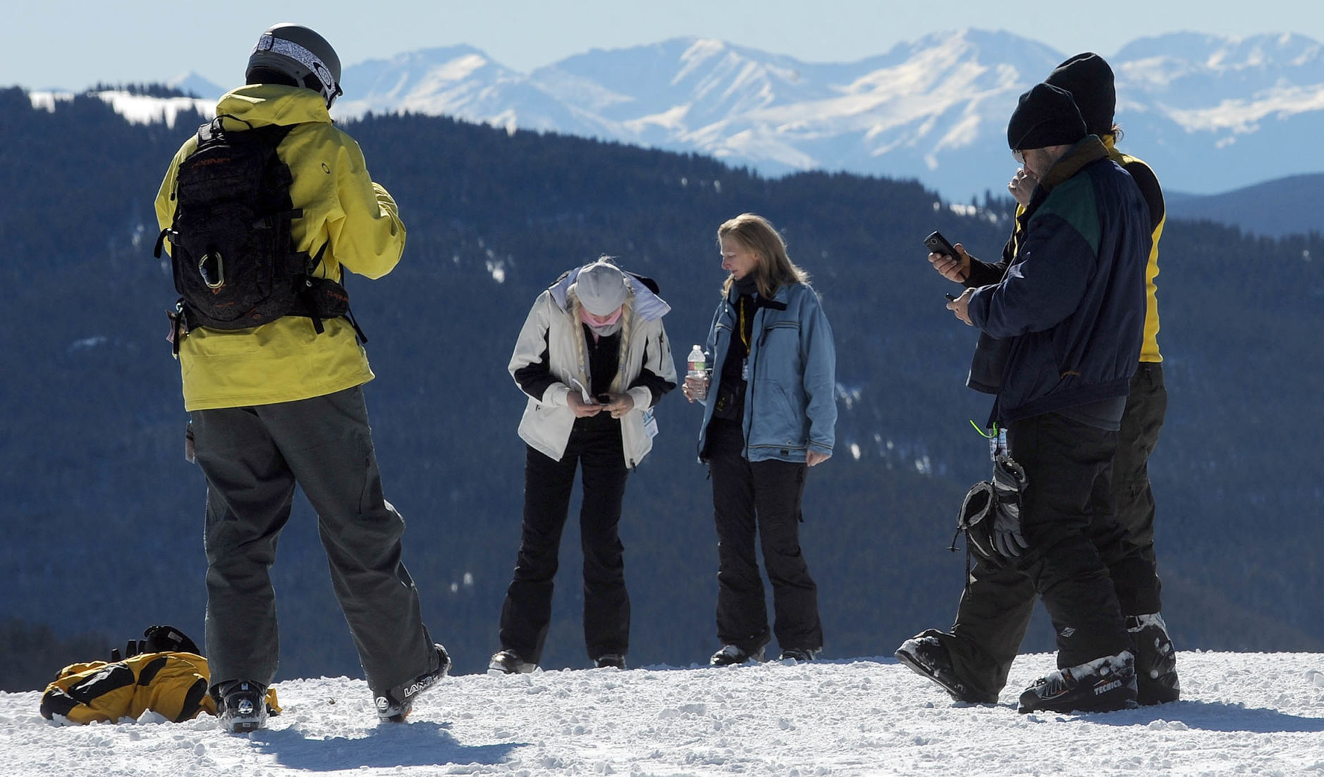 Skiers check their phones on the top of Blue Sky Basin at Vail. (Christian Murdock, Gazette file)