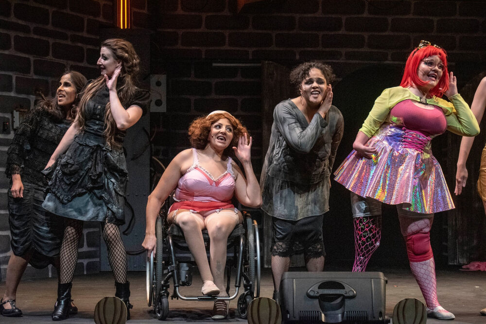 Visual description: Five actors performing in Phamaly Theatre Company's 'The Rocky Horror Musical,' from left: Phoenix Mehta, Miranda Ireland, Jasmine Gonzalez, Nicole Bailey and Madison Stout. (MICHAEL ENSMINGER/PHAMALY)