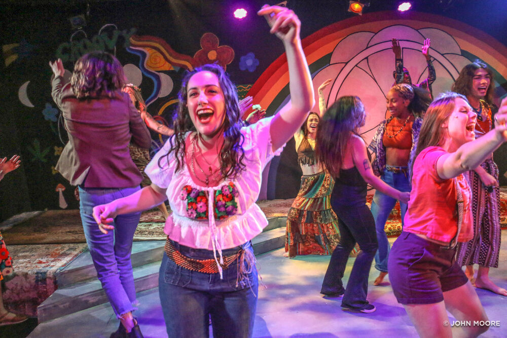 By the end of 'Hair' at Miners Alley Playhouse, cast members like Valerie Igoe, left, were dancing with the audience on the stage. (JOHN MOORE/DENVER GAZETTE)