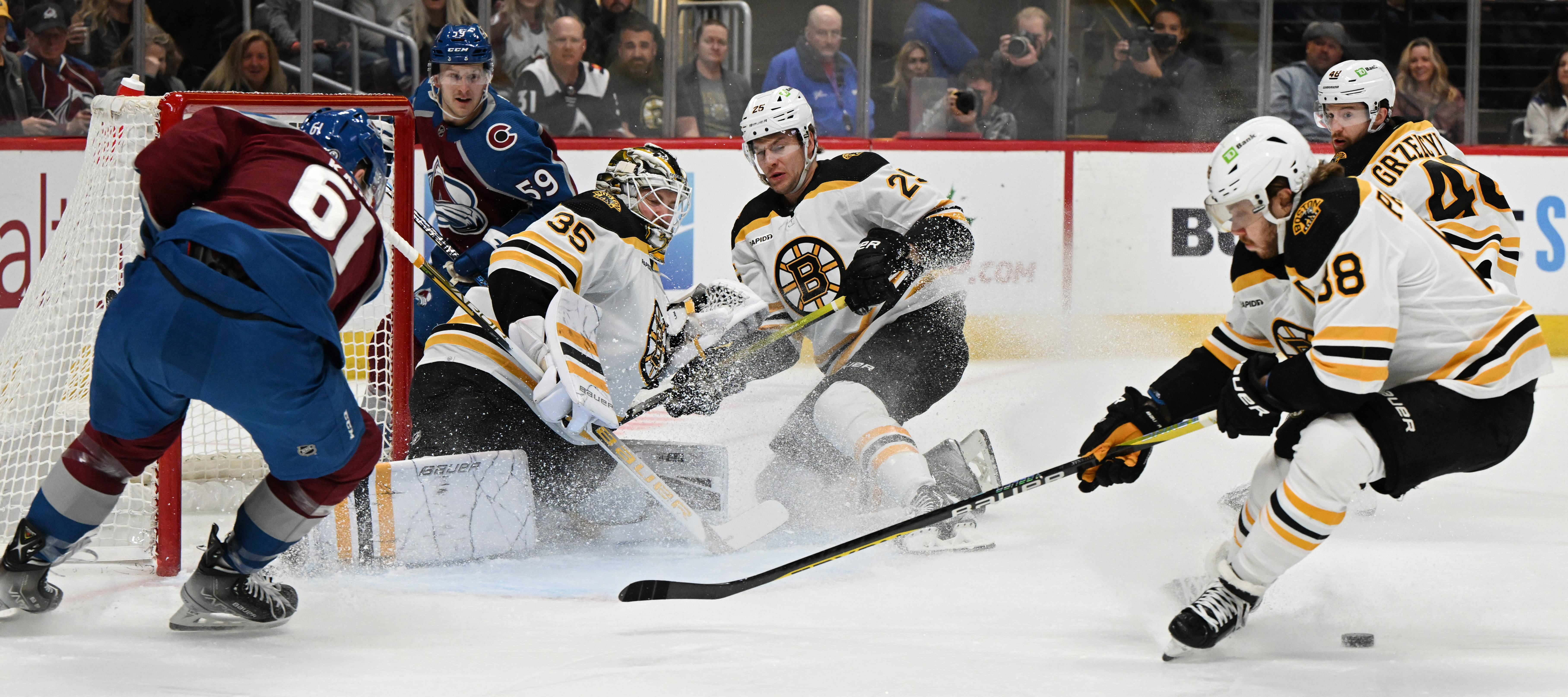 Boston Bruins goaltender Linus Ullmark (35) makes save as Colorado Avalanche right wing Martin Kaut (61) and center Ben Meyers look for a rebound during the first period Wednesday, Dec. 7, 2022, at Ball Arena in Denver. (The Gazette, Christian Murdock) (Christian Murdock/The Gazette)