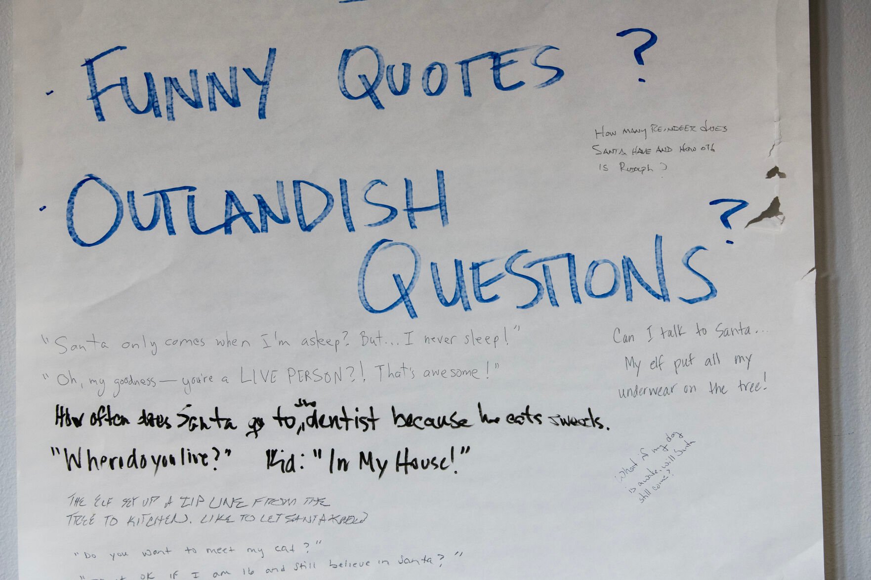 Quotes and questions from callers are written on a large piece of paper at the NORAD Tracks Santa Operations Center. (The Gazette, Parker Seibold) (Parker Seibold)
