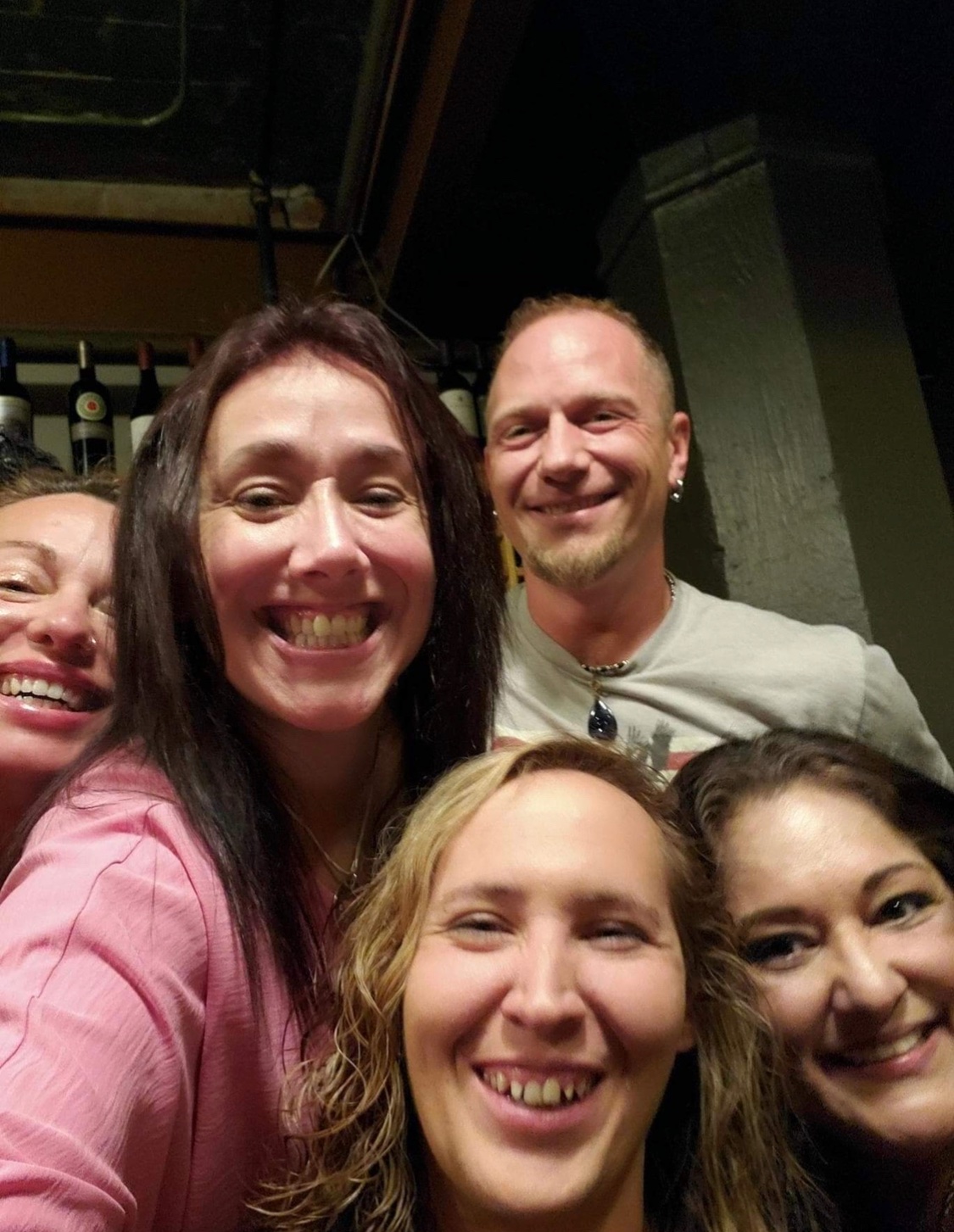 Charlene Slaugh (bottom center) and Tina Siegfried (in pink) have remained good friends since they met six years ago. This is a photo from Siegfried's birthday taken last March. (COURTESY OF TINA SIEGFRIED)