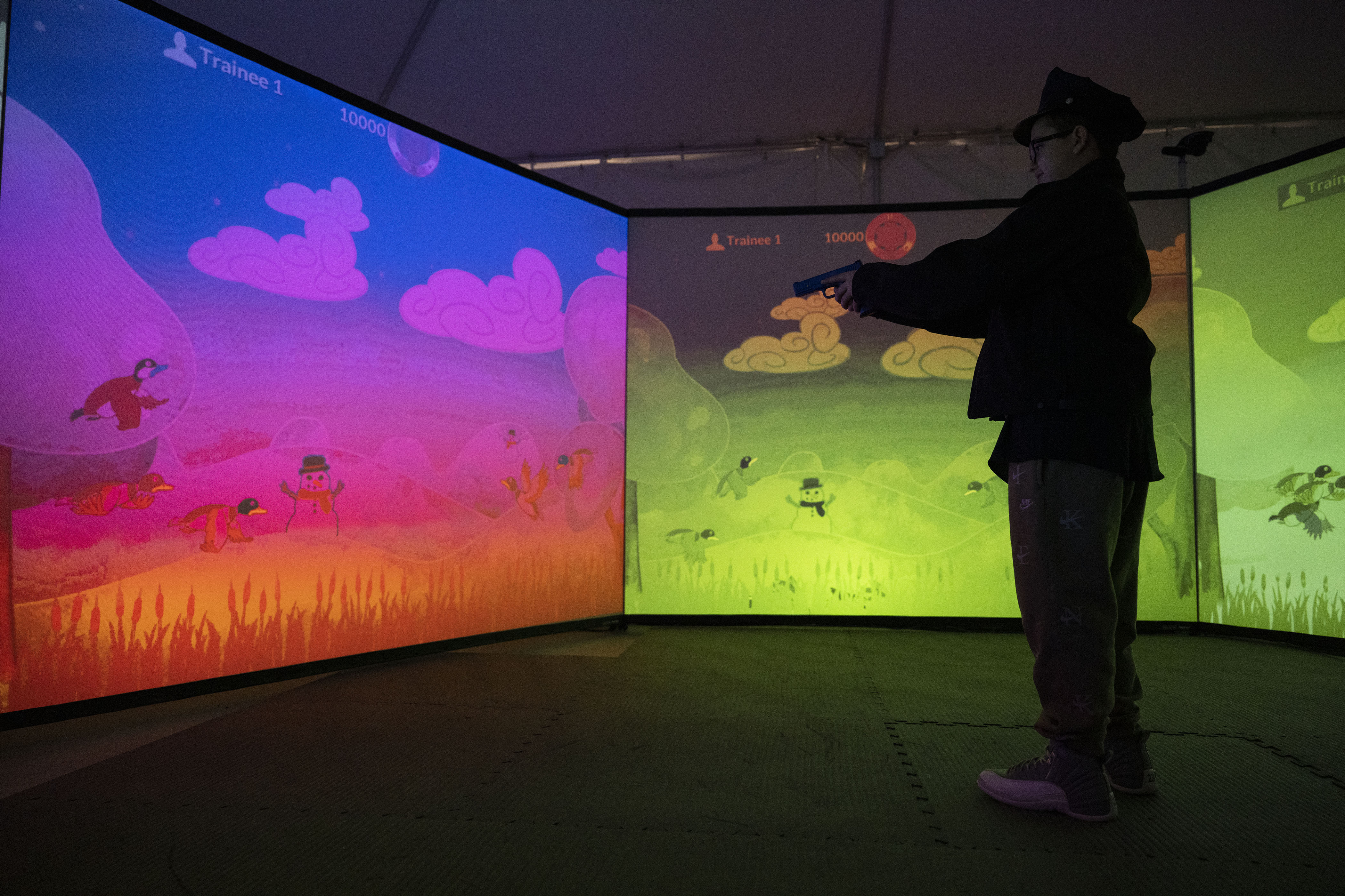 Kamorin, 14, no last name given, plays a game of duck-hunt in the VirTra training simulator after a tour of the Denver Police Academy and a simulated ride along on Friday, Dec. 23, in Denver, Colo. On August 22, 2022, Kamorin was being driven home from school when a bullet fired nearby hit him in the arm. Denver police arrived and performed initial first aid. (Timothy Hurst/The Denver Gazette) (TimHursttim.hurst@gazette.comhttps://secure.gravatar.com/avatar/aca82bd62b4ee425c598527cd6faa1b1?d=mm&r=g)