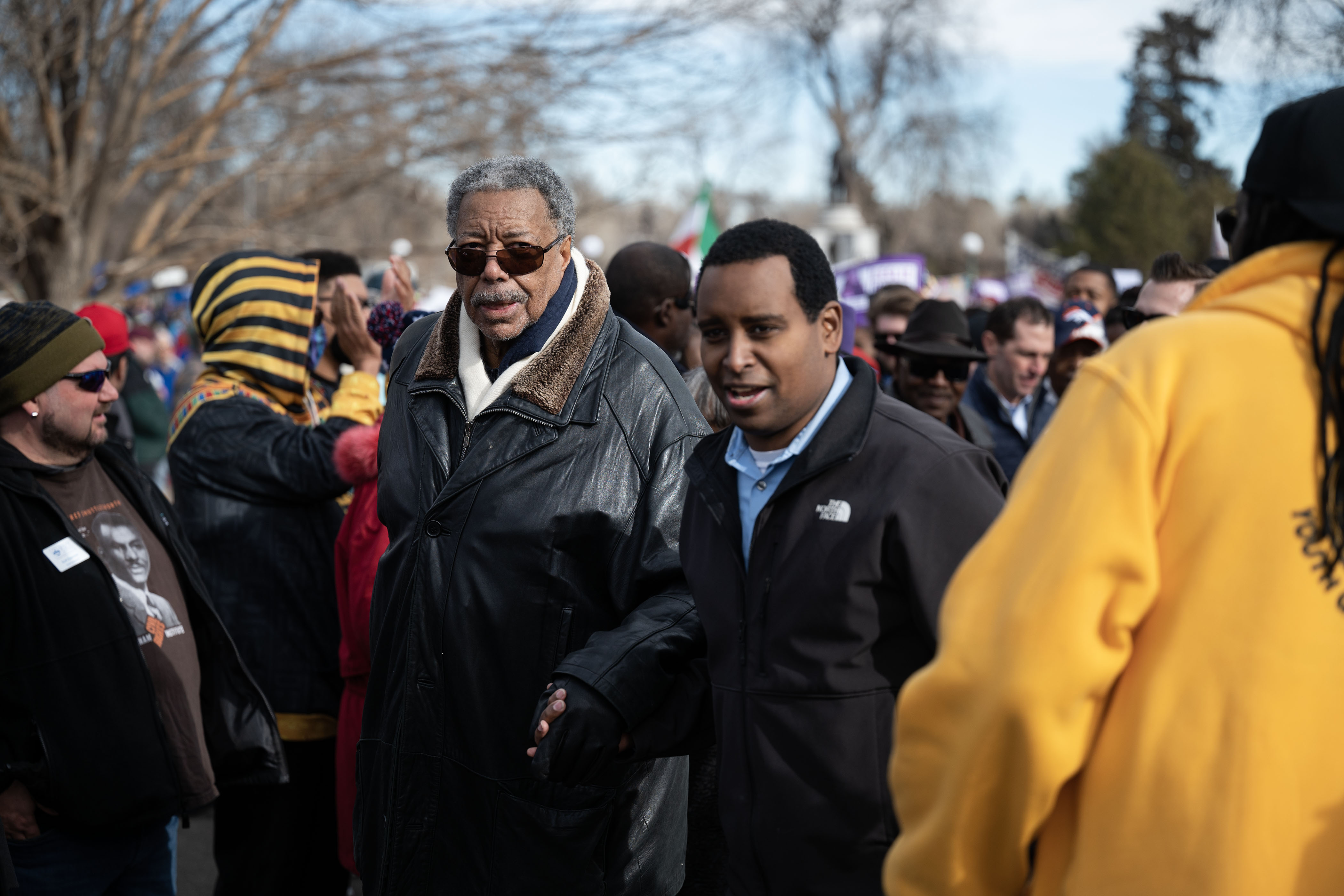 U.S. Rep. Joe Neguse helps former Denver mayor Wellington Webb through the crowd during Denver's annual Martin Luther King Jr. Day marade on Monday, Jan. 16, 2023, in Denver, Colo.(Timothy Hurst/The Denver Gazette) (TimHursttim.hurst@gazette.comhttps://secure.gravatar.com/avatar/aca82bd62b4ee425c598527cd6faa1b1?d=mm&r=g)