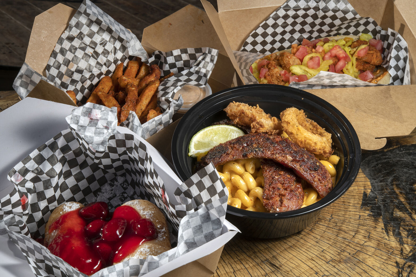 Po’ Brothers Cajun (Located at: 1826 E. Platte Ave.) “Fried Twinkie, Mac and Cheese with Andouille Sausage, Cajun Fries and Shrimp Po’Boy To-Go” Thursday January 12, 2023. Photo by Jeff Kearney. (Jeff Kearney)