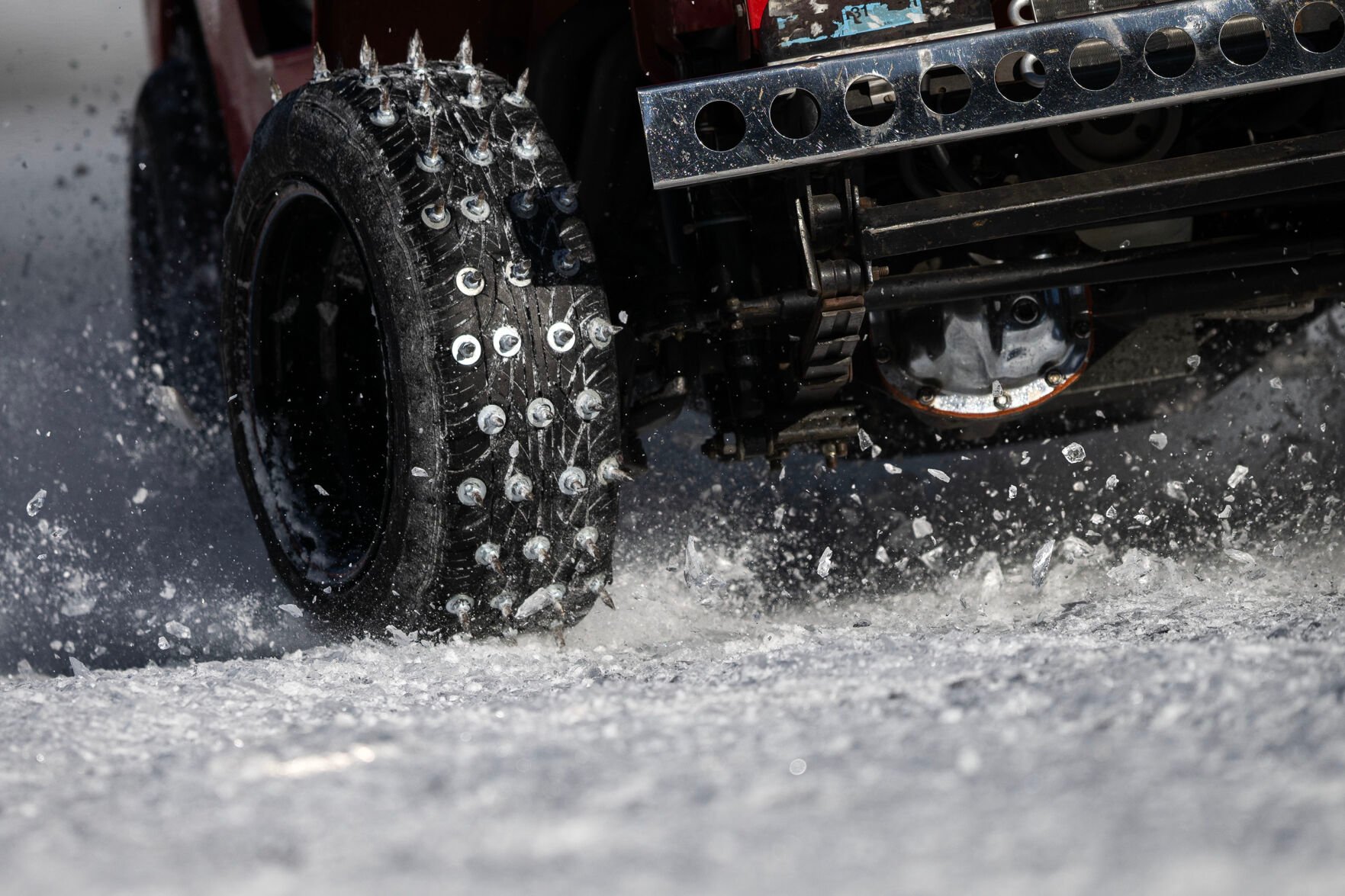 Ice explodes off the frozen lake under the “Cheater” tires on Joe Huffaker’s race Jeep during the first day of the Our Gang 4 Wheelers ice racing club’s 2023 racing season on Saturday, Jan. 7, 2023, in Georgetown, Colo. The Cheater division is named for the tires used, which have 1 1/2 inch sharpened bolts protruding from them. (Timothy Hurst/The Denver Gazette) (TIMOTHY HURST/DENVER GAZETTE)