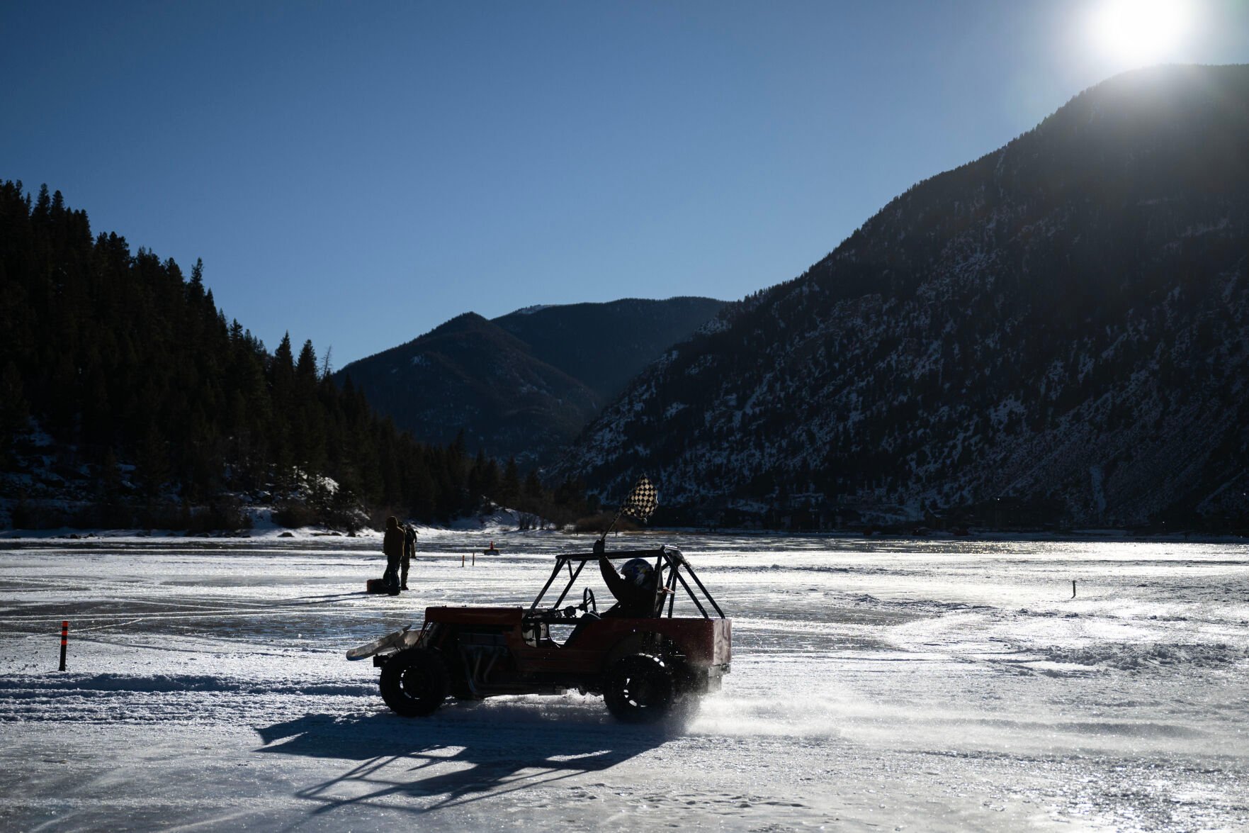 Men’s Competition Cheaters race winner Lee Bashline takes a victory lap during the first day of the Our Gang 4 Wheelers ice racing club’s 2023 racing season on Saturday, Jan. 7, 2023, in Georgetown, Colo. The Cheater division is named for the tires used, which have 1 1/2 inch sharpened bolts protruding from them. (Timothy Hurst/The Denver Gazette) (TIMOTHY HURST/DENVER GAZETTE)