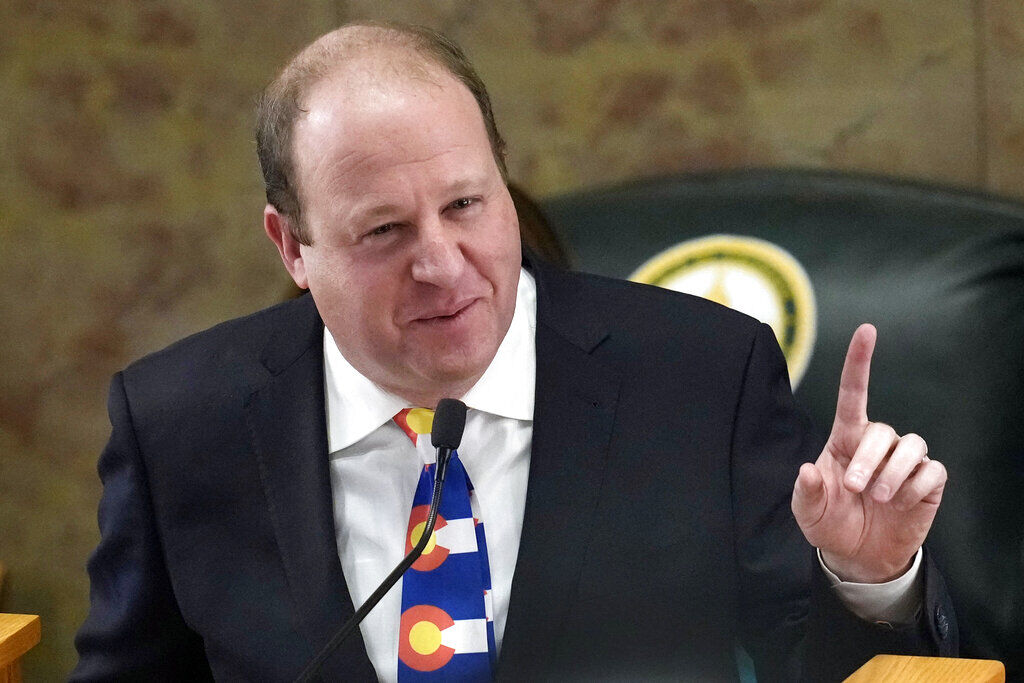 Colorado Gov. Jared Polis delivers his State of the State address to lawmakers assembled in the House of Representatives chamber in the State Capitol, Tuesday, Jan. 17, 2023, in Denver. (AP Photo/David Zalubowski) (David Zalubowski)