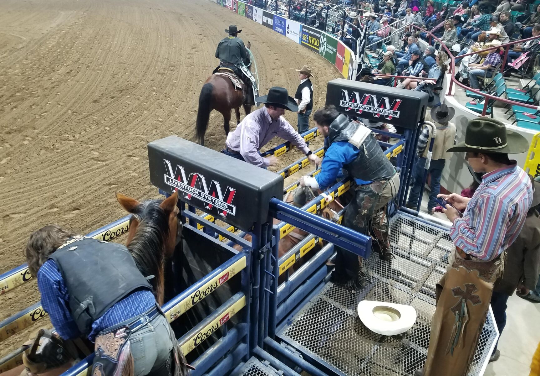 Cowboys ready for bronc riding at Saturday’s semifinals for the Colorado vs. The World Rodeo. (Mark Samuelson, Special to the Denver Gazette)