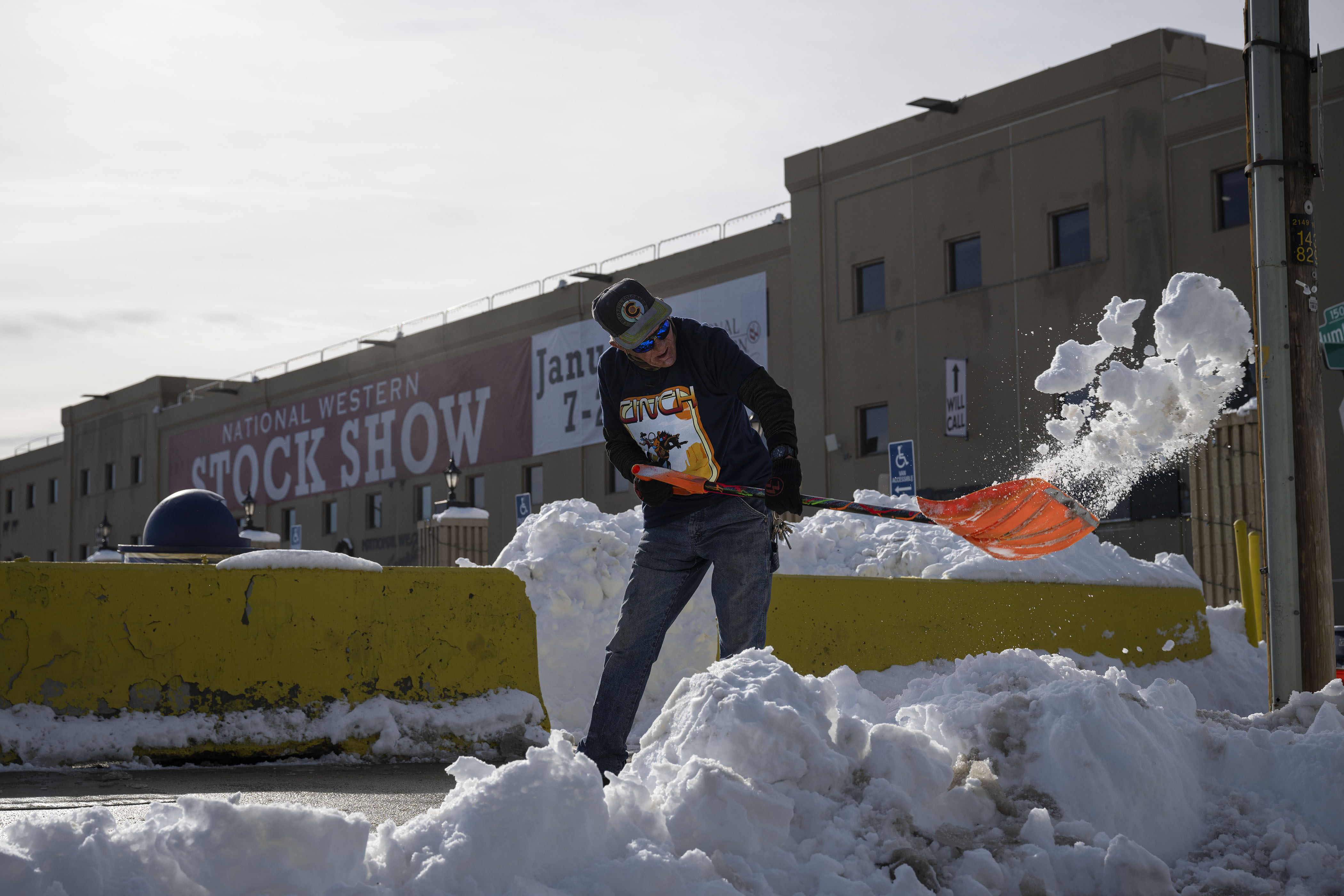 Outside groundskeeper Jack Havird clears snow from the sidewalks outside of the National Western Complex Expo Hall on Friday, Dec. 30, in Denver, Colo. The National Western Stock Show begins this Jan. 7. (Timothy Hurst/The Denver Gazette) (TimHursttim.hurst@gazette.comhttps://secure.gravatar.com/avatar/aca82bd62b4ee425c598527cd6faa1b1?d=mm&r=g)