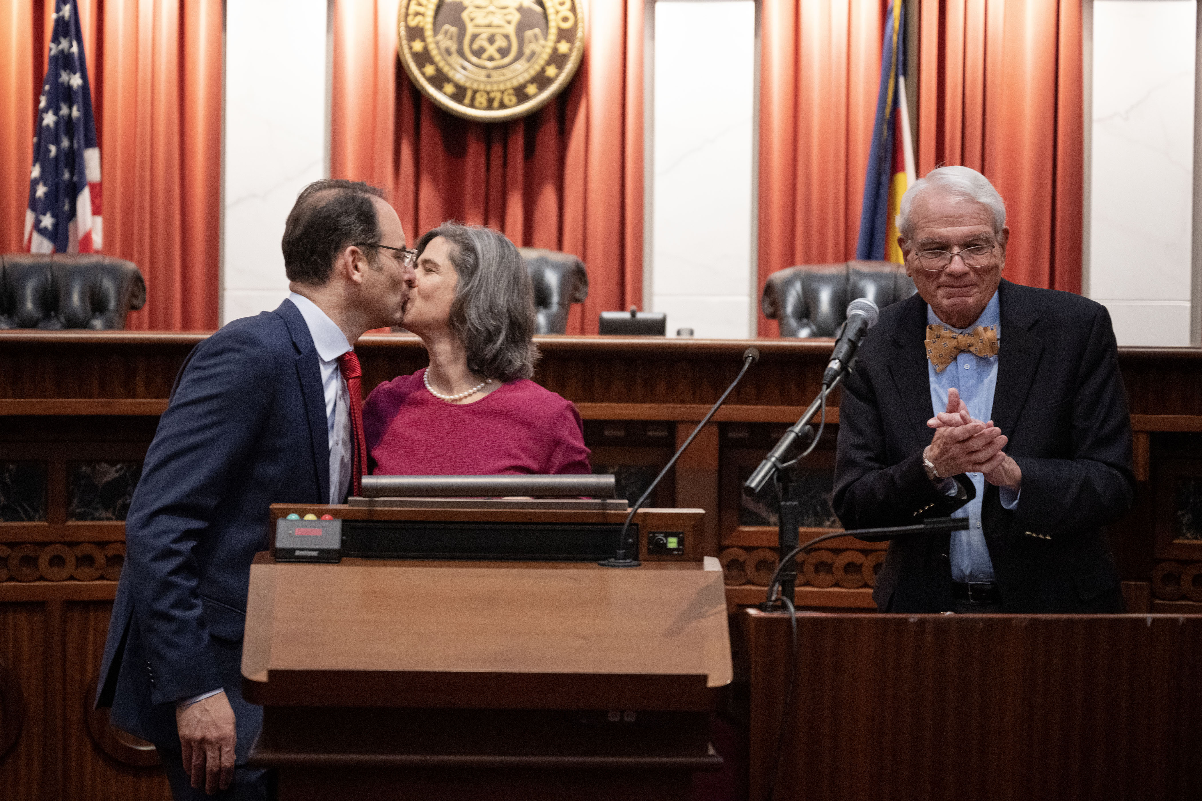 Attorney General Phil Weiser and his wife Heidi Wald kiss after taking the oath of office administered by Judge David Ebel during the investiture ceremony for Weiser’s second term in the Colorado Supreme Court chambers on Thursday, Jan. 12, 2023, in Denver, Colo.(Timothy Hurst/The Gazette) (TimHursttim.hurst@gazette.comhttps://secure.gravatar.com/avatar/aca82bd62b4ee425c598527cd6faa1b1?d=mm&r=g)