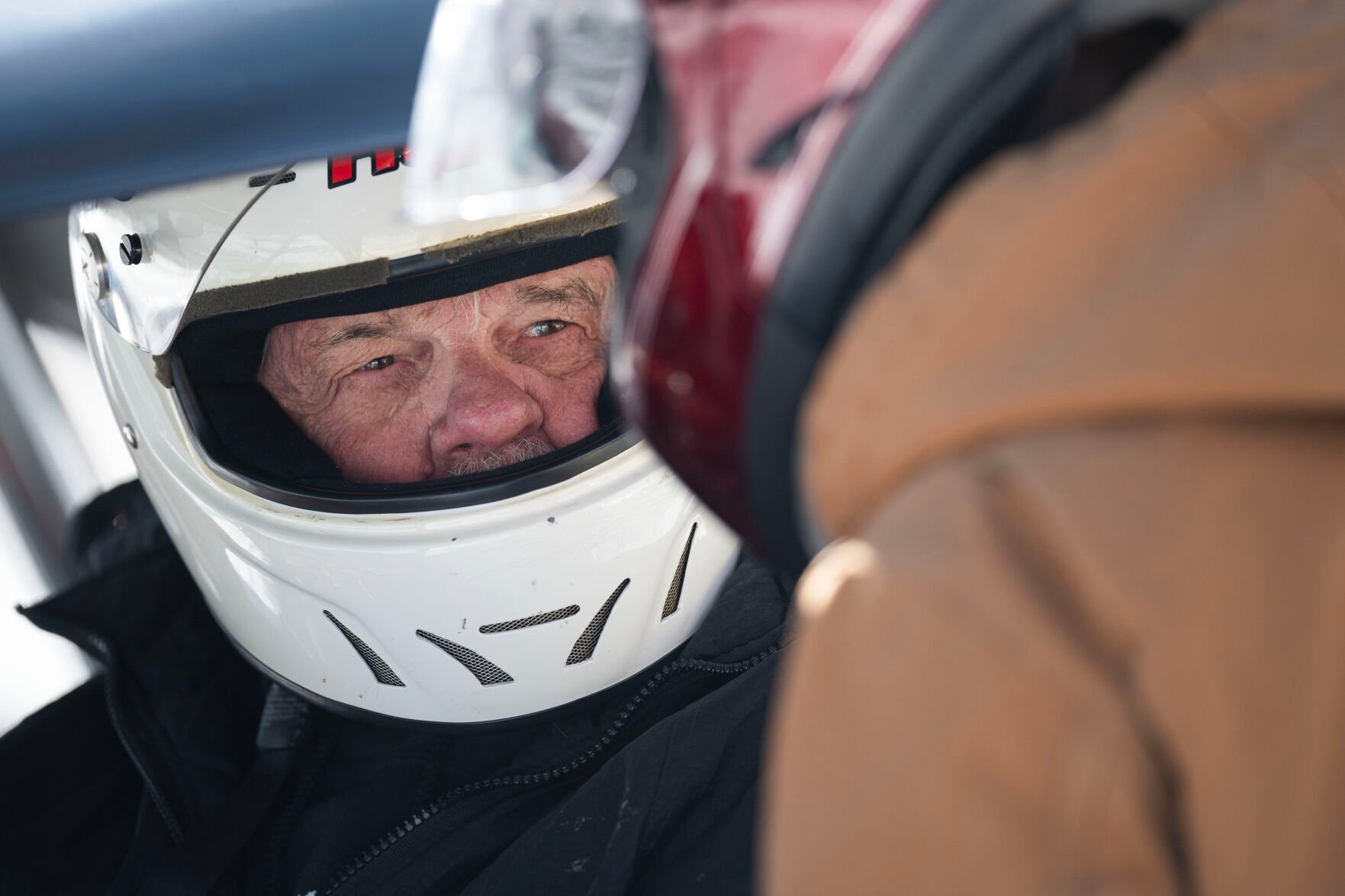 Dave Ling strategies with his grandson Cody Ling after a race in the Men’s Pro Street Studs division during the first day of the Our Gang 4 Wheelers ice racing club’s 2023 racing season on Saturday, Jan. 7, 2023, in Georgetown. (Timothy Hurst, The Gazette)