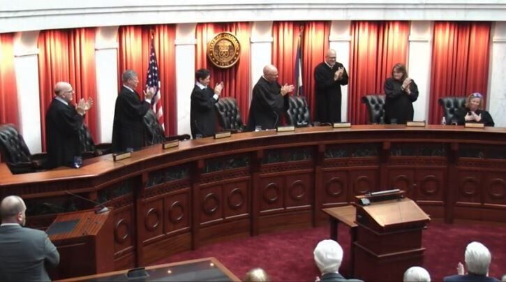 Attendees applaud Justice Maria E. Berkenkotter following her formal swearing-in to the Colorado Supreme Court on Sept. 23, 2022.