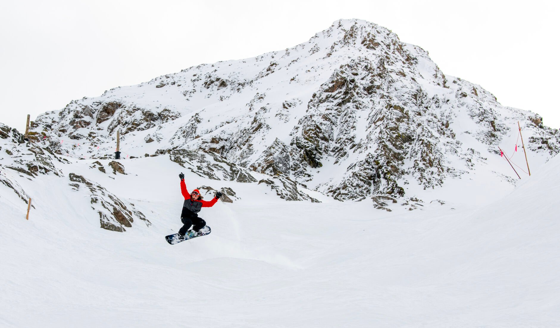 A snowboarder jumps over a mogul at Arapahoe Basin this week. Snowpack across most of the state is strong, hitting 128% of average in the area around Arapahoe Basin. (Parker Seibold, The Gazette)