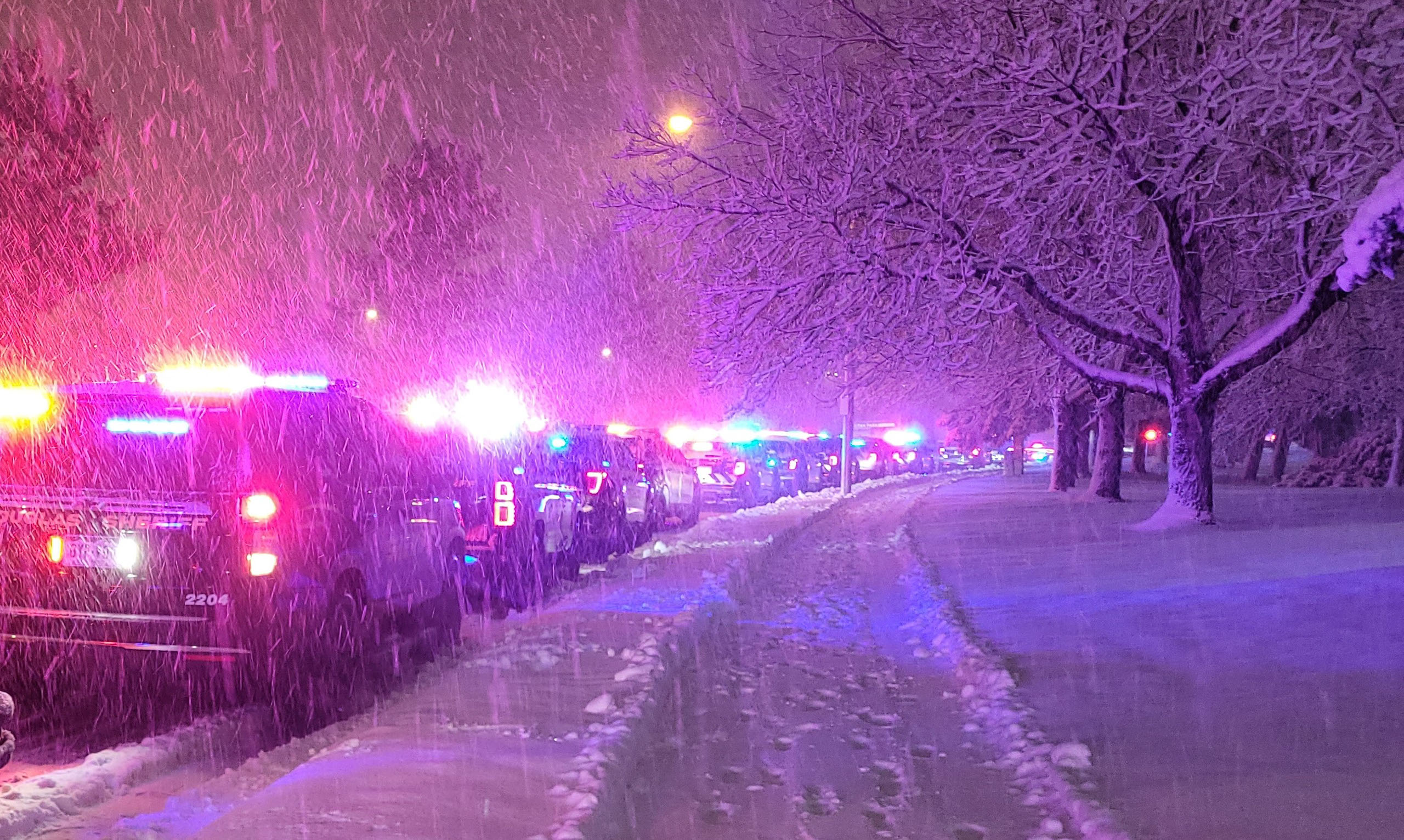 Law enforcement vehicles from different agencies prepare for a procession to transport Deputy Kraig Conger's body to the Arapahoe County Coroner's Office. (COURTESY OF THE ARAPAHOE COUNTY SHERIFF'S OFFICE)