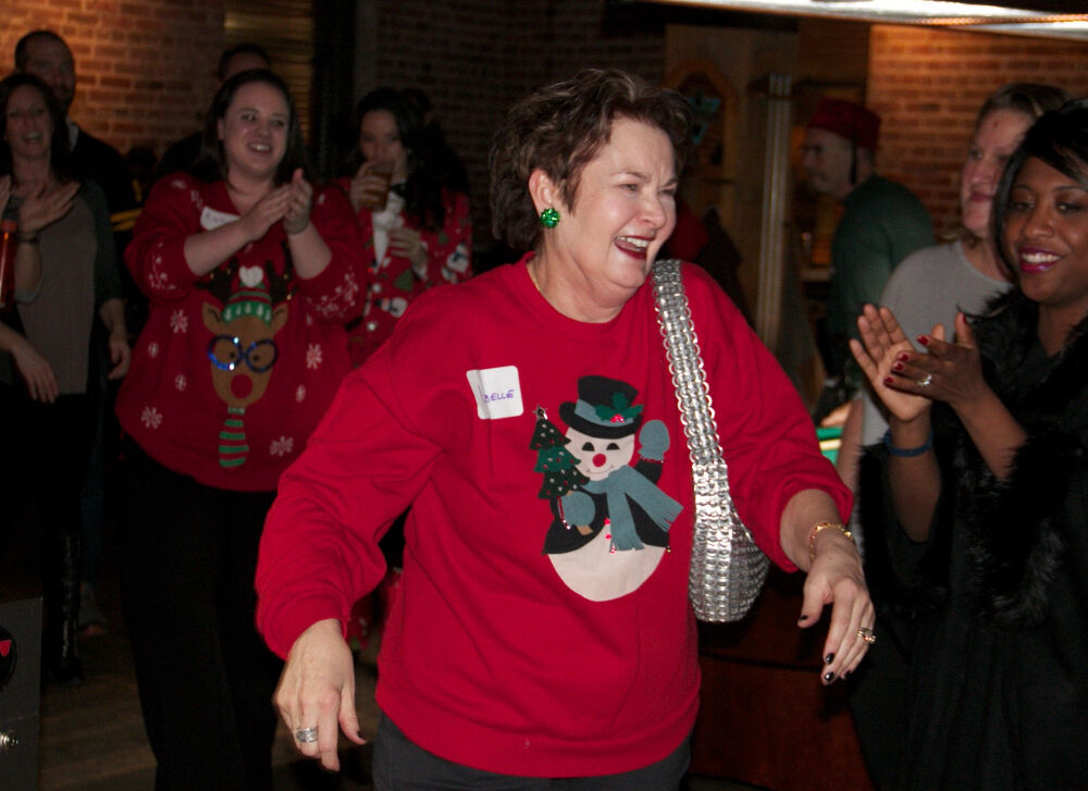In a proud moment, Isabelle Clark winning the Denver Center's annual ugly sweater contest. (JohnMooreSenior Arts Journalistjohn.moore@denvergazette.comhttps://denvergazette.com/content/tncms/avatars/e/1e/bc8/e1ebc854-8dbc-11ec-90b8-e393b5c0a2b9.afcf882df81bc4eba7366657cc603f75.png)