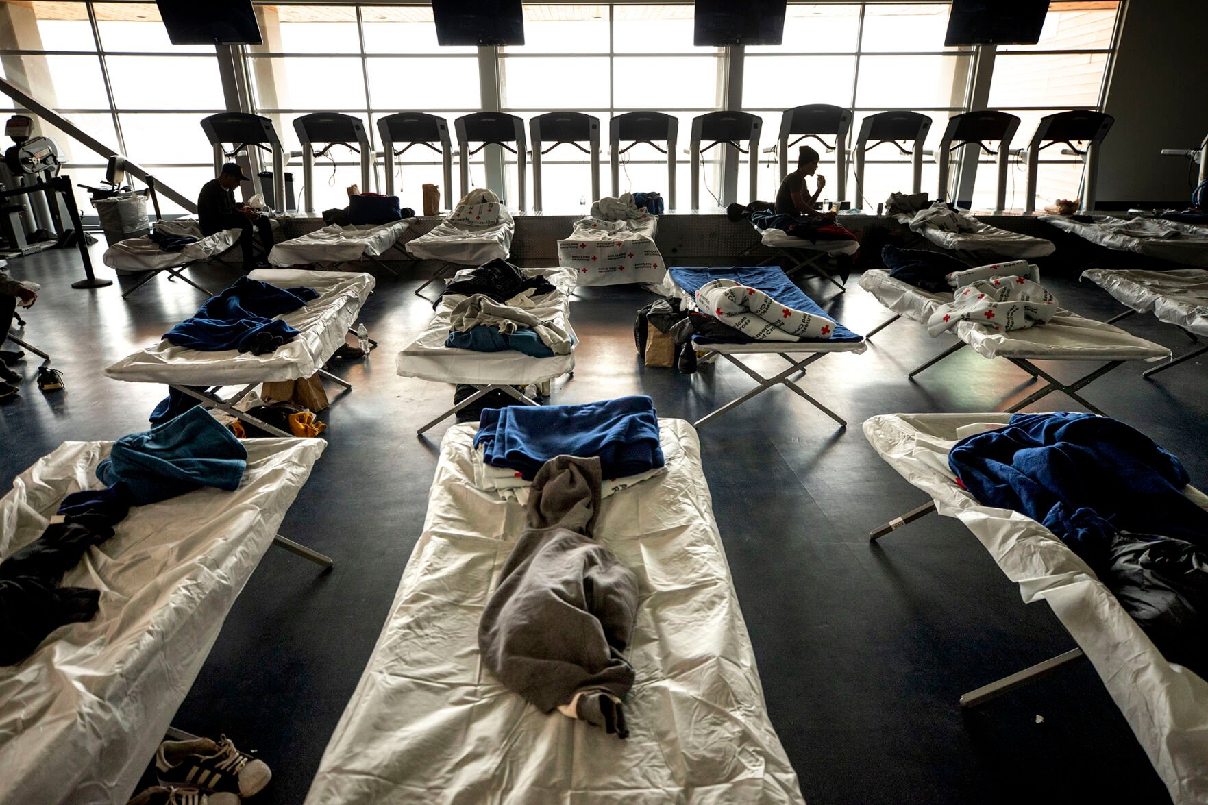 Cots were set up in an emergency shelter for people arriving from the southern U.S. border at a Denver rec center Dec. 13. (The denver gazette)