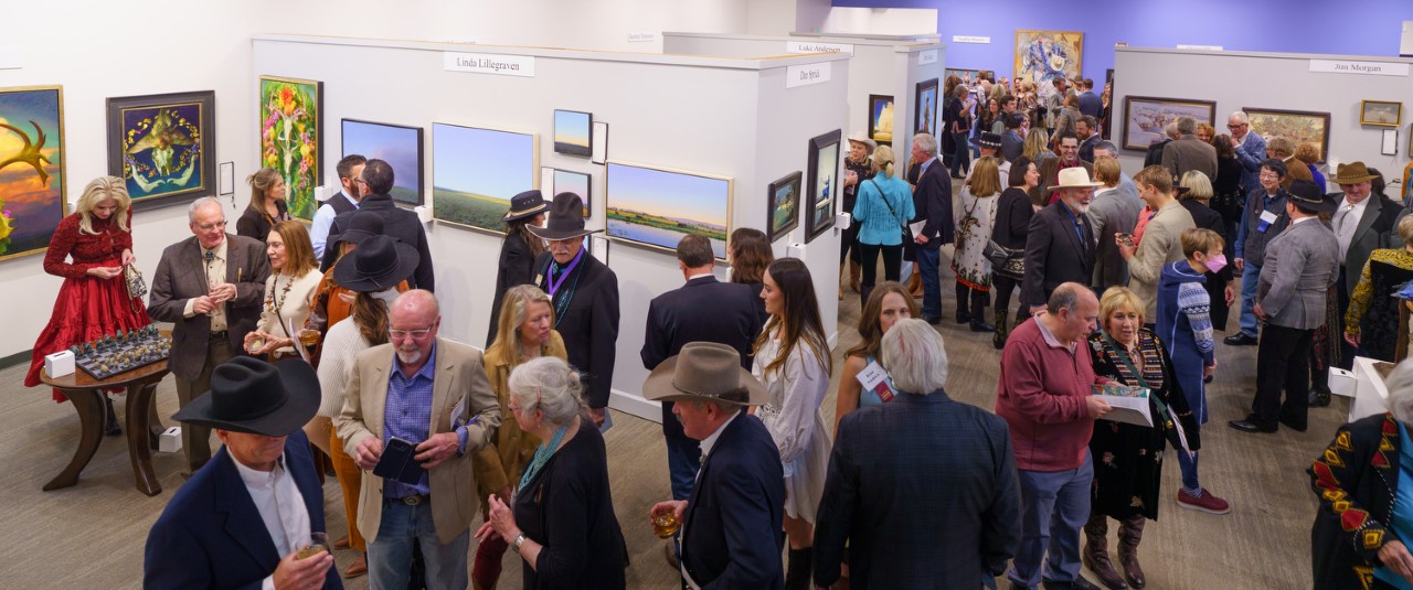 Patrons peruse the art during the bid period. The 2023 Coors Western Art Exhibit & Sale Red Carpet Reception at the National Western Stock Show Expo Hall, Coors Western Art Gallery, in Denver, Colorado, on Tuesday, Jan. 3, 2023. Photo StevePeterson.photo (STEVE PETERSON/SPECIAL TO COLORADO POLITICS)