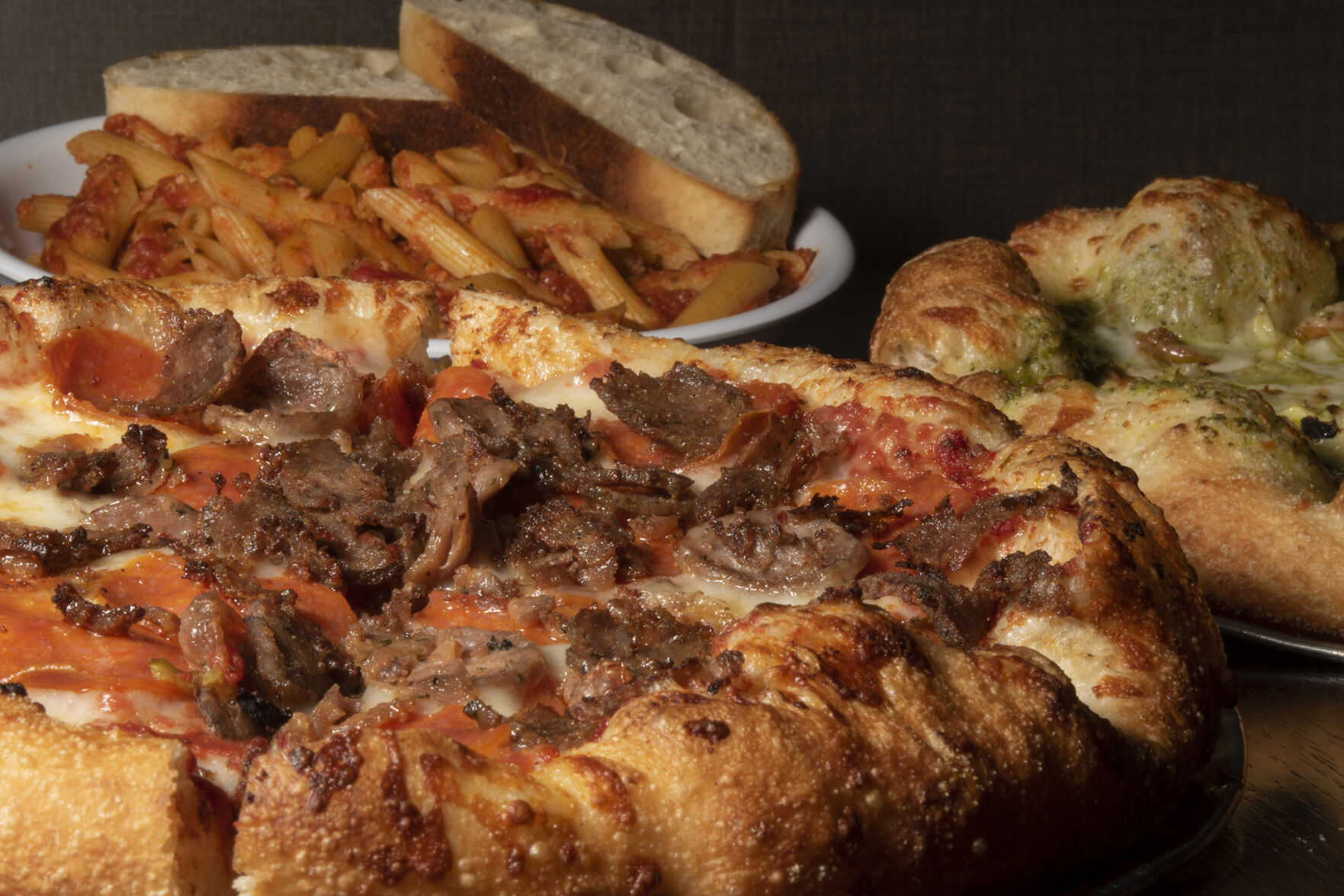 Mici Italian Restaurant (Located at: 3707 Bloomington St.) “Molto Carne Pizza with Cristofori Pizza and Cortonese Pasta” Monday December 119, 2022. Photo by Jeff Kearney. (Jeff Kearney)