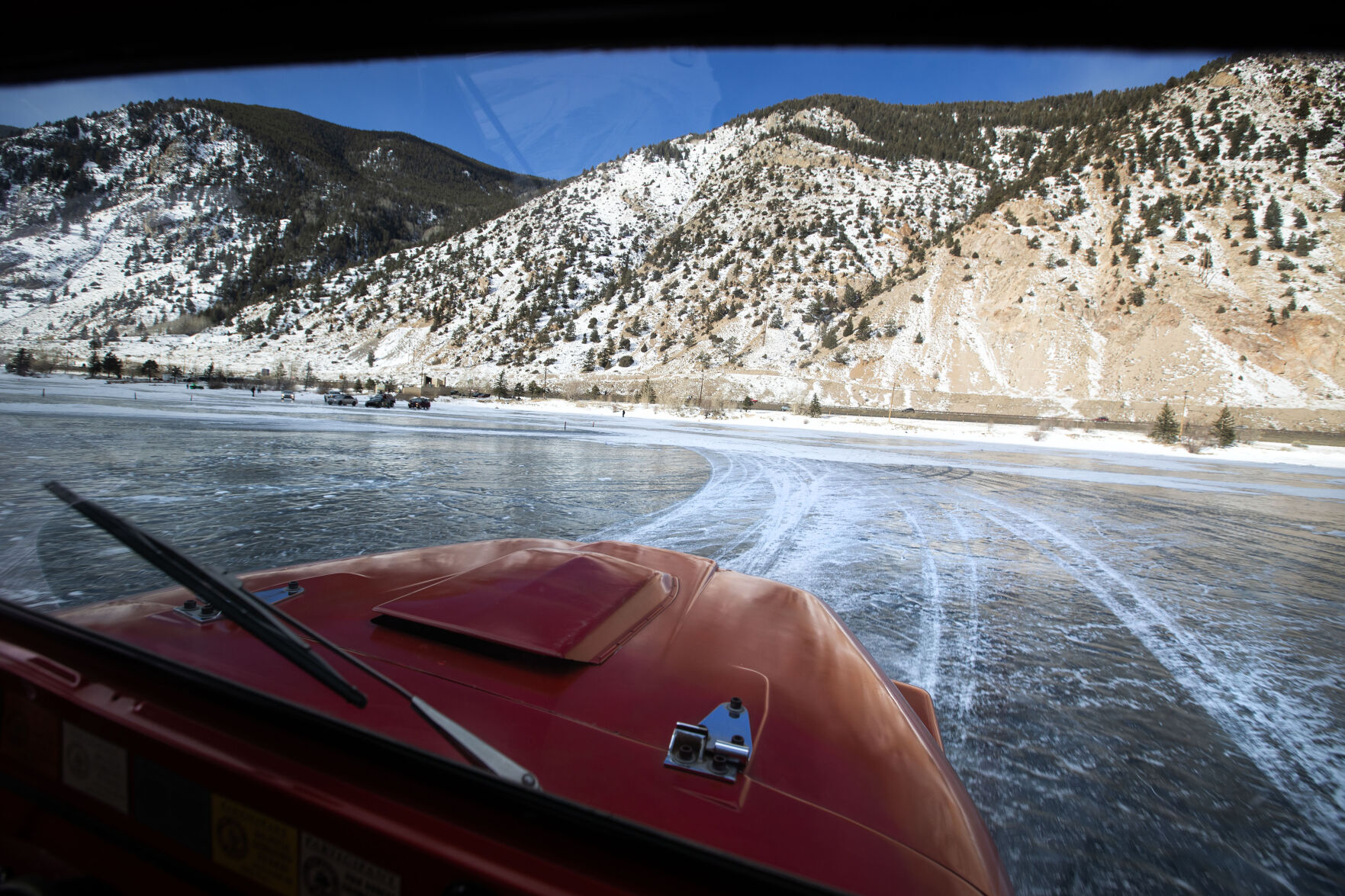 The sun comes out over the lake while Cody Ling takes a practice lap before the start of the first day of the Our Gang 4 Wheelers ice racing club’s 2023 racing season on Saturday, Jan. 7, 2023, in Georgetown, Colo.(Timothy Hurst/The Denver Gazette) (TimHursttim.hurst@gazette.comhttps://secure.gravatar.com/avatar/aca82bd62b4ee425c598527cd6faa1b1?d=mm&r=g)
