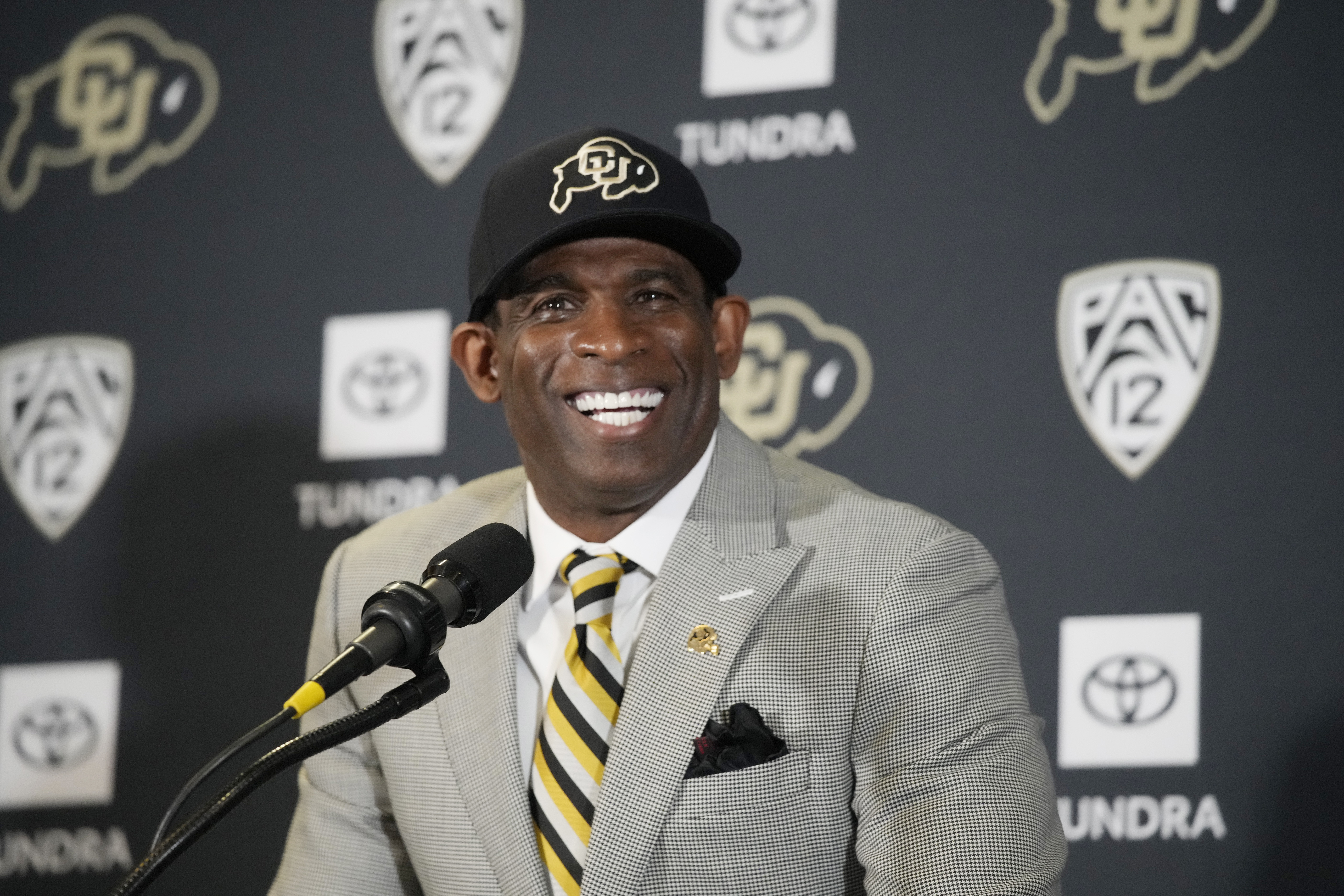 Deion Sanders speaks after being introduced as the new head football coach at the University of Colorado during a news conference Sunday, Dec. 4, 2022, in Boulder, Colo. Sanders left Jackson State University after three seasons at the helm of the school's football team. (AP Photo/David Zalubowski) (David Zalubowski)