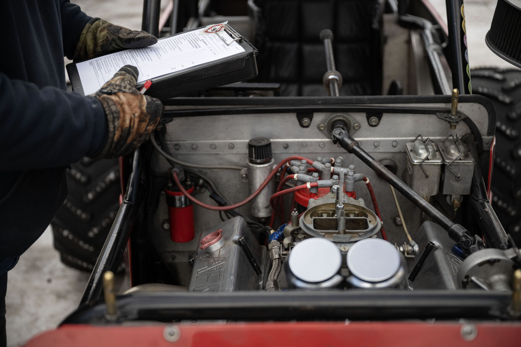 Joe Huffaker inspects Lee Bashline’s highly modified single-seater Willys Jeep CJ-3A during the first day of the Our Gang 4 Wheelers ice racing club’s 2023 racing season on Saturday, Jan. 7, 2023, in Georgetown, Colo.(Timothy Hurst/The Denver Gazette) (TimHursttim.hurst@gazette.comhttps://secure.gravatar.com/avatar/aca82bd62b4ee425c598527cd6faa1b1?d=mm&r=g)